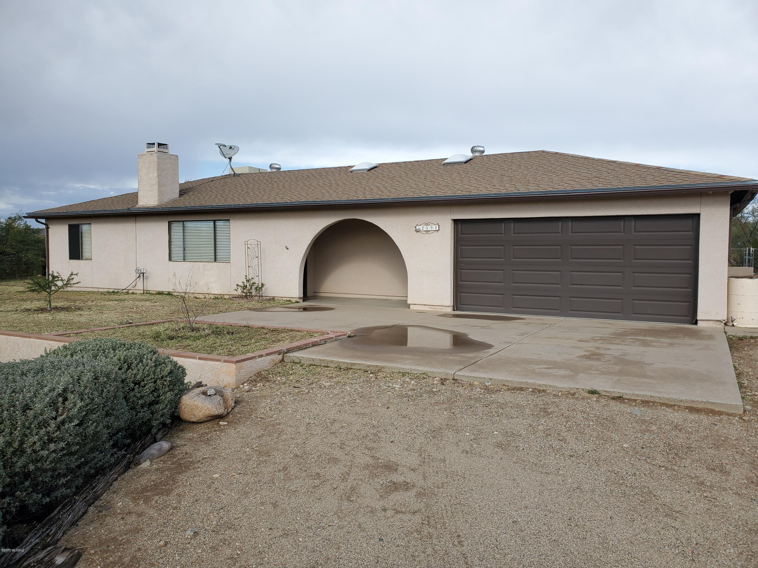 Spectacular 3 bedroom/2 bathroom home on 1 and 1/2 acres with no HOA! This fabulous property offers a great room concept with beehive fireplace, tile floors and split bedroom floor plan. Remodeled throughout to include ceiling fans, upgraded lighting, french doors to beautiful covered back patio. Eat in kitchen offers ample cabinets, all stainless appliances and a great view. 2 car garage with workshop, storage shed, screened porch, evaporative cooler, Vail School district. Bring your toys! Call Daniel to schedule a viewing. 520-777-6507 ext. 2. https://youtu.be/FXrx2eRxPPY