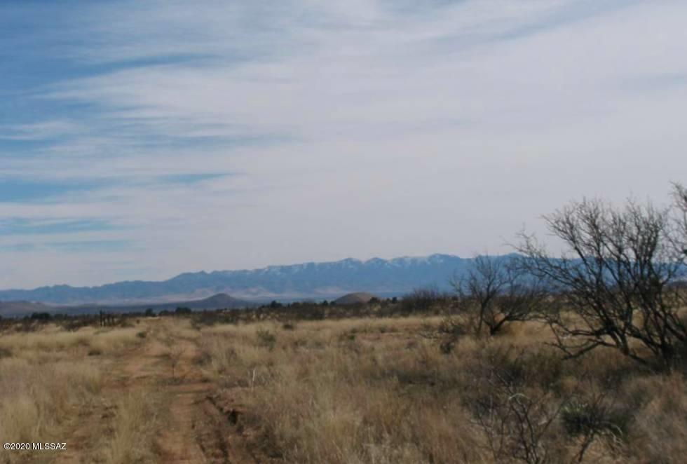 Approx 1.07 ACRE total. Nice level building site. Fabulous panoramic views!  Rural setting and lovely views.  Ideally suited for living off the grid.  Less than a mile to the National Forest!