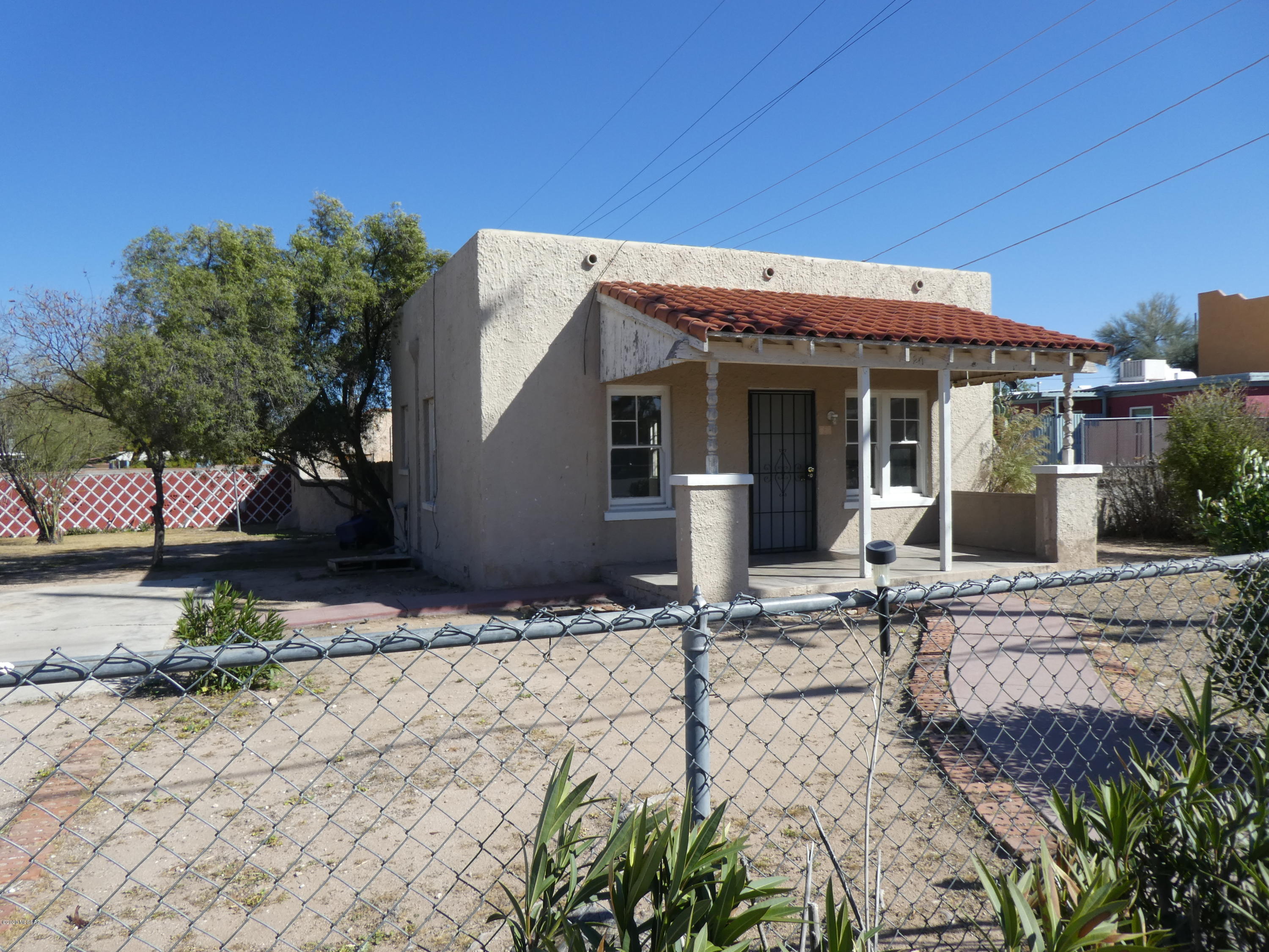 This is an Excellent , property. It is R3,  There
is a X-tra small unit in the back. The home in the front is a two bedroom 0ne bath. You can live in one and build on the HUGE lot.
An Investors Dream.  Near the U of A.

Viewing after accepted Contract