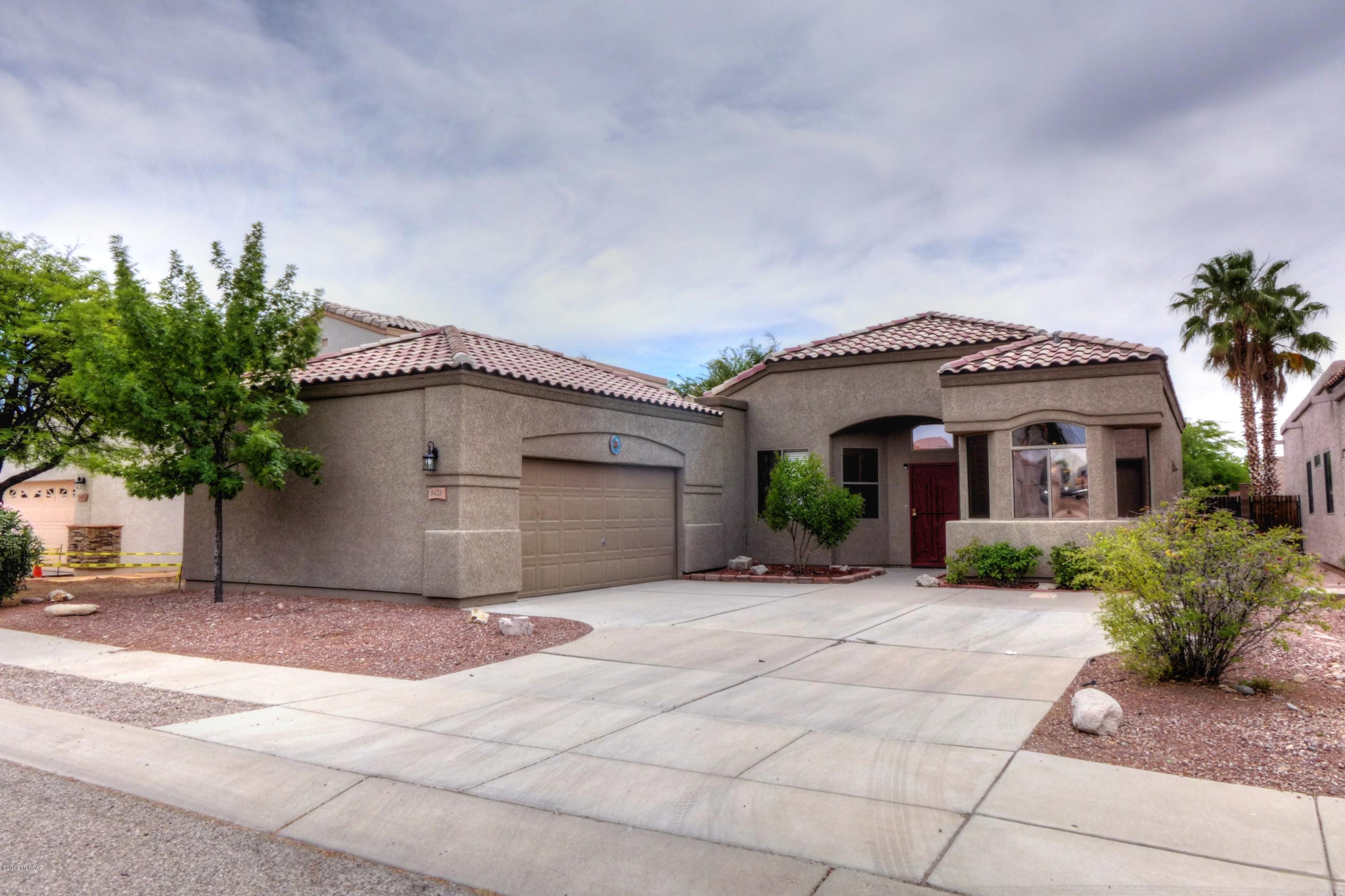 Beautiful, Eastside 3 Bdrm/2 Bath Plus Den, Vail School District. Bright and open Great room floor plan with high ceilings. Den has double door closure. Galley kitchen w/stainless steel appliances. Breakfast nook. Large Master bedroom with walk-in closet. Master bath has separate garden tub/shower and dual sinks. Low care landscaped front/back yards. Backyard has extended covered patio, perfect for entertaining. Ceilings fans, sky lights, bay windows, laundry room w/ W/D hook up, 2 car garage with storage Close to DMAFB (Houghton/Rita Road)