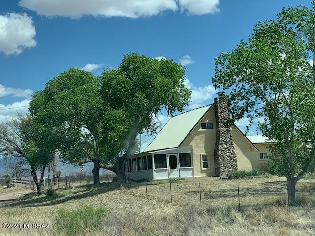 Historic home on 36.01 Acres. Horse property. Home is Adobe with 14'' walls.  Brand new Screened in porch on the front with insulated roof and walls for easy conversion. 2 bedroom but den is being used as a third. Private well with an 8'' casing. Historic concrete water well cistern on the homestead. Western Rd cedar storage building which is insulated and can be used as a home office of tack room. Rock out- building which is a wine cellar. Saltillo Tile in the home with a pellet stove in the living room. Wood burning fireplace in the Den. Plus baseboard heat. Home has a metal roof and lots of windows with good light. Covered back porch. Lots of large shade trees and fruit trees on the property. 4 Apple, 3 Apricot, Ash trees, Cottonwood and Pin oak.
