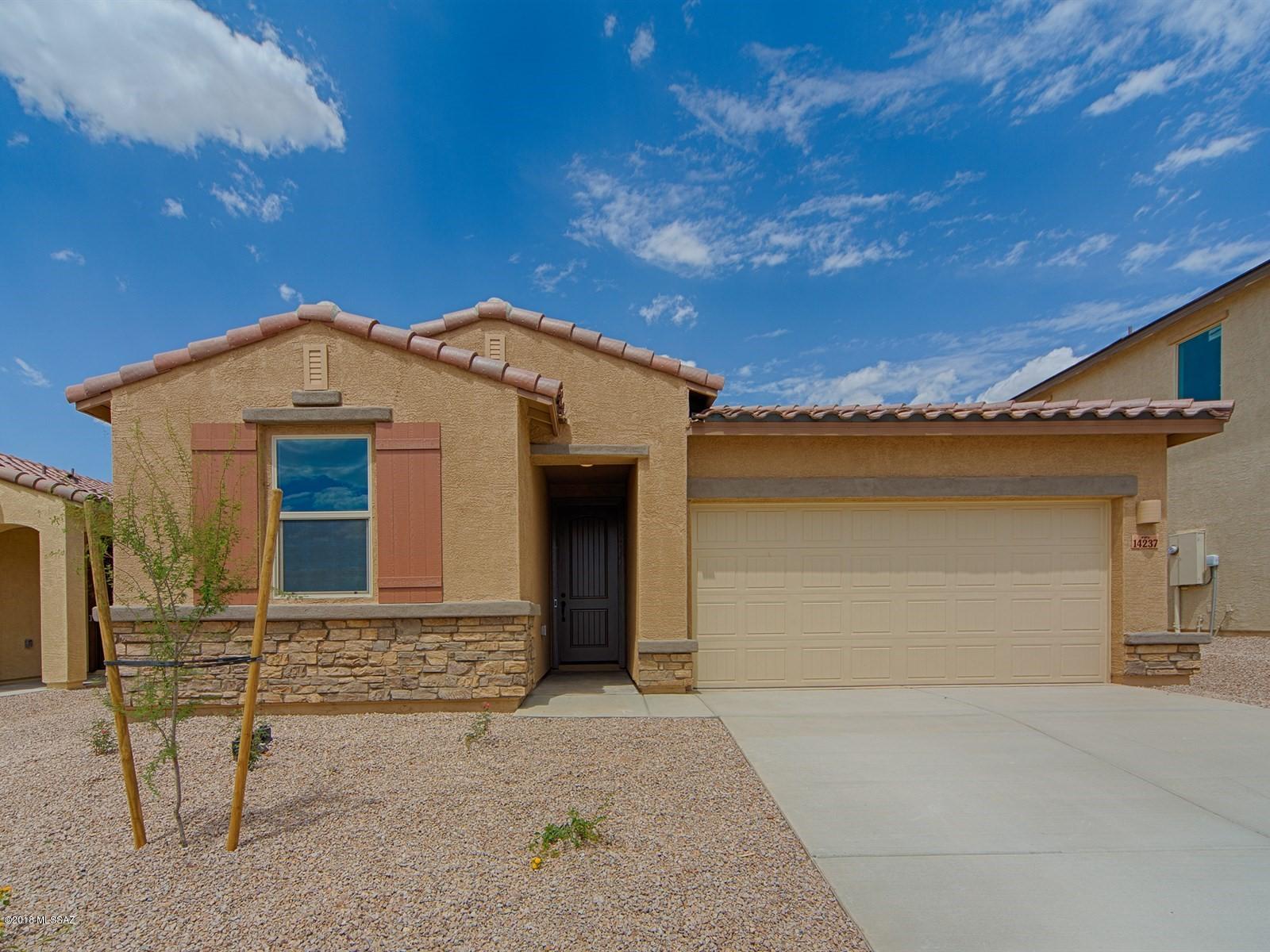 Brand NEW energy-efficient home ready NOW! Entertain with ease in this spacious open kitchen with adjoining great room and dining room in the stunning Garnet. The kitchen is equipped with SS Appliances, cabinets in a slate color, and granite countertops. Upper cabinets in the laundry room with bronze hardware on all doors. Escape to the private master suite to relax and unwind. Copper Ridge at Rancho Del Lago is situated beside the Rincon Mountains and within walking to Vail school district. Known for their energy-efficient features, our homes help you live a healthier and quieter lifestyle while saving you thousands on your utility bills.