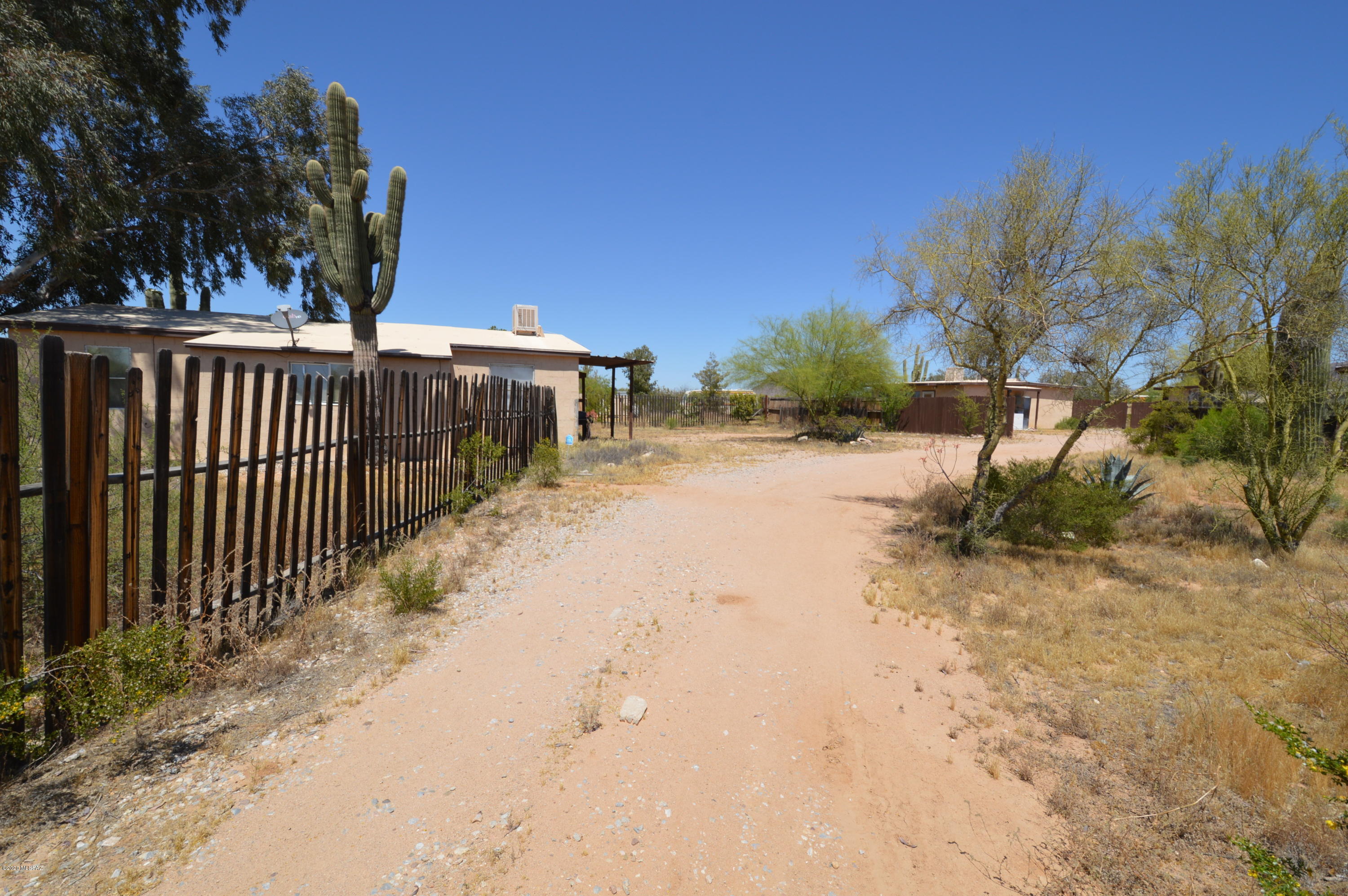 Affixed MH with addition, plus older MH (no value) and threee additional buildings that include kitchens and baths, built without permits. All sold ''as is''. Gorgeous 1.6 acre parcel with lots of upside for the right buyer.  NO SPDS, NO CLUE, NO FINANCING. Cash subject to inspection only.  All ow 3 business days for acceptance.
