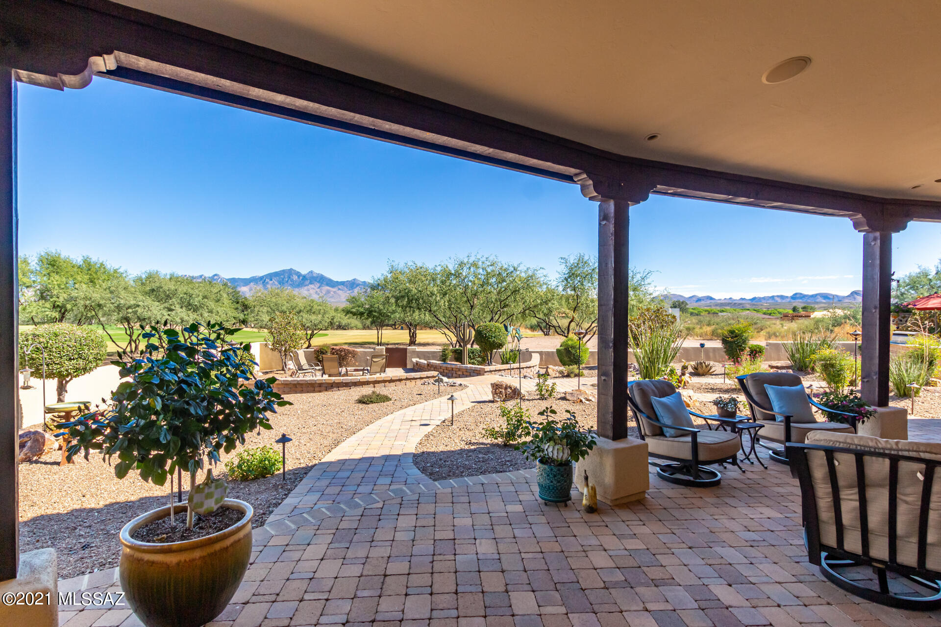 For the most discerning of buyers...this exquisite custom-built home was professionally designed with upgrades and touches that truly set it apart. No detail overlooked. Nestled next to the 3rd Green of the Tubac Golf Resort's Anza Course, you'll enjoy panoramic views of the Santa Rita Mountain Range from your luxurious retreat. A stunning entry brings you into the spacious great room with its beautiful fireplace with a custom mesquite mantel, and the exquisite chef's kitchen with Thermador appliances and the 48'' dual fuel range with custom stone hood detail, a large pantry, as well as a full wet bar with lighted cabinetry. 3 BR, 3 BA, with large master bedroom and bath with fireplace. Designer touches everywhere! Large laundry room and extended garage with epoxy floor. Features of this home include custom sound system with 26 mounted speakers including garage and patio, custom lighting and Smart Panel with Category 5 and RG6 coax run to every room, security prewired to all doors and windows, all natural stone tile, engineered hardwood floors in bedrooms, solid core wood doors throughout, and central vacuum system with access in the garage for cleaning vehicles, and water softener. The 1,100 sq.ft. patio is equipped with a large seating area, dining area, and separate seating are off the main bedroom, and has three fans, six ceiling mounted speakers, as well as two electric heaters with dedicated 50 amp. service. Patio pavers are on concrete slab.