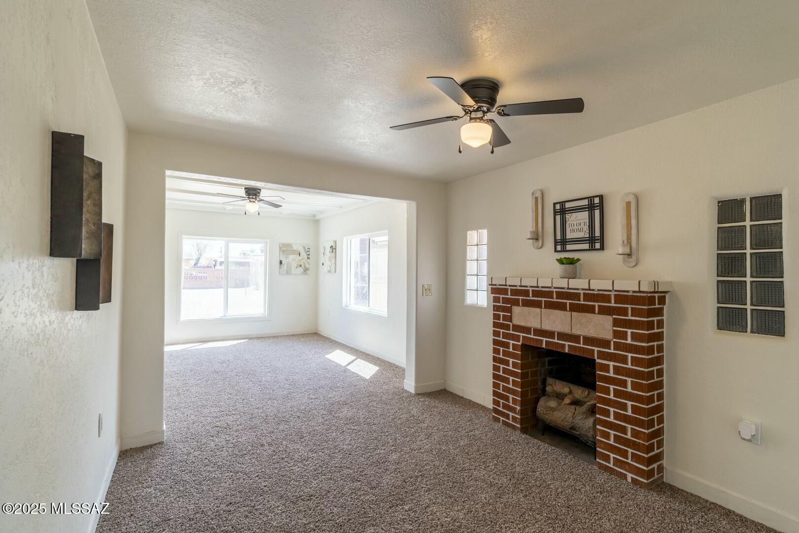 Upgraded three bedroom two bathroom brick exterior home with new carpet, light fixtures (interior & exterior), water heater, toilets, shut off valve and fresh paint (interior & exterior). New electric panel and breakers. AC and roof are 1.5 years old. New windows are dual pane. 

Kitchen has been updated with a new garbage disposal, new appliances and a gourmet kitchen sink. Large laundry room with extra storage space. Additional storage outside in the covered carport. Separate front entrance. Spacious fully fence .17 acre yard. 

Potential to be converted to a 2/1 with a studio apartment with separate entrances. Fireplace is decorative.

Seller financing opportunities possible.