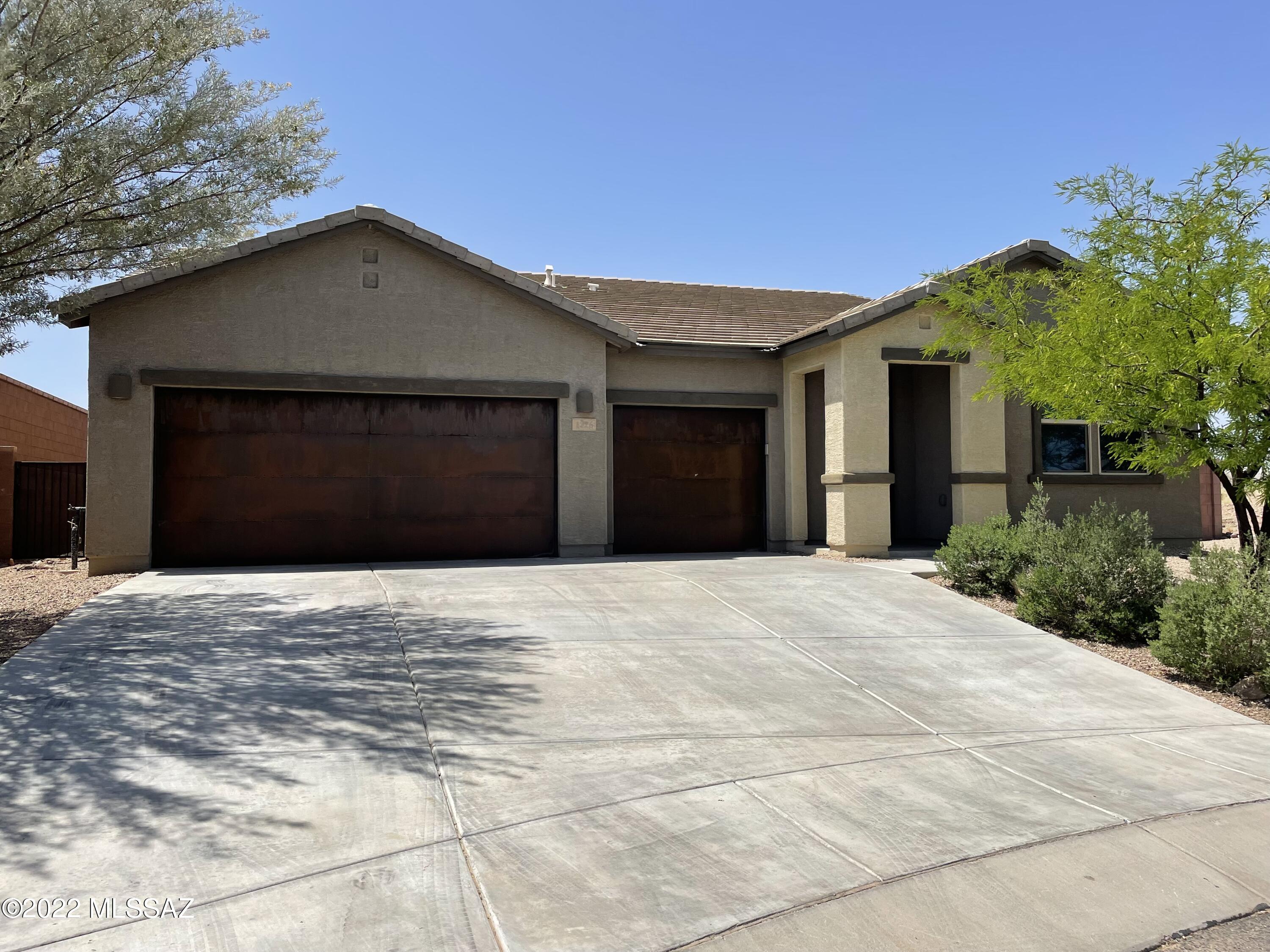 This gorgeous gem in the gated community Encore in Madera Highlands. The extra-large lot sits on a quiet cul-de-sac with only 2 other homes no front neighbor and back neighbor. It faces and backs to green space with break taking views of Mt. Wrightson and Green Valley Skyline. Upon entering this home mesmerizes you with absolutely gorgeous wood floor tile flooring, soft paint palettes, and an open floor concept! The Primary room has an enormous walk-in closet and roll-in shower with floor­ to-ceiling tile and dual sinks with quartz counters. The community boasts a park, playground complete with a covered ramada & access to the Madera Highlands Pool. Owner/Agent. Both of the Sellers are licensed real estate agents in the state of Arizona.