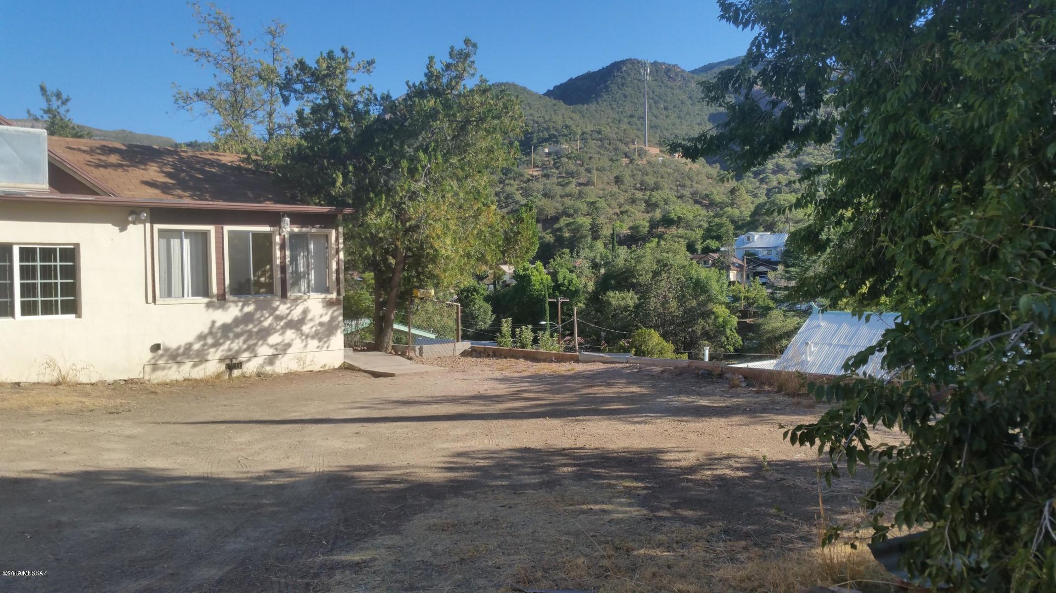 Hidden from Tombstone Canyon thoroughfare, though adress is Tombstone Canyon, sits a quiet home off the  main road. Owner has occupied this home since the 50's. Technically 2 Bedrooms, one more closet and it will be 3 with 1 Full Bathroom. NO STAIRS. PLENTY OF LEVEL PARKING. View is wonderful with sunsets as a bonus. Home has been cared for and maintained over the years. New roof in 2010, newer kitchen and dual-paned windows. Small efficient workshop on concrete pad just off the kitchen. Square footage may be larger than tax records indicate. Buyer to verify all facts and figures.