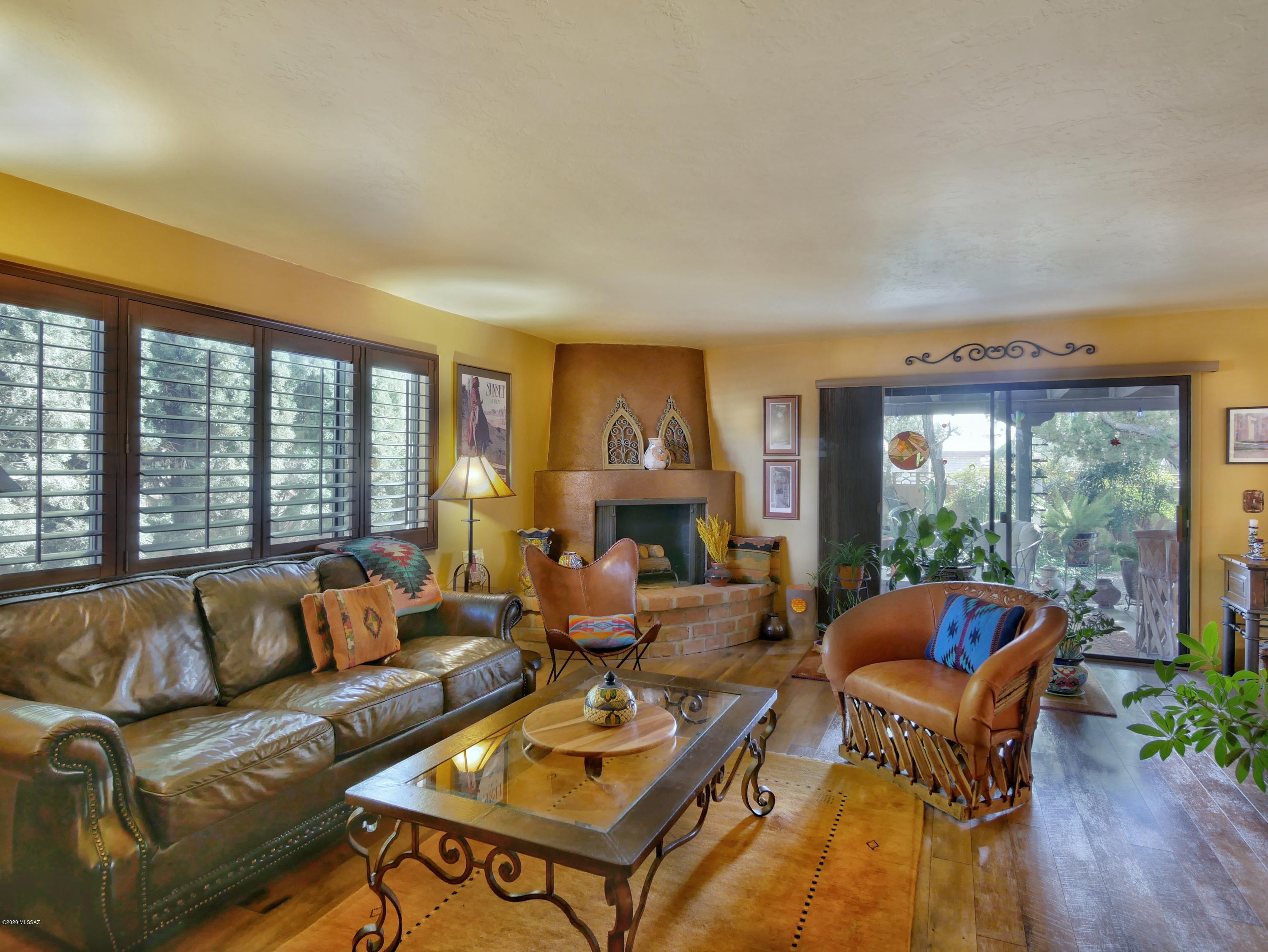 The pictures attest to why this is called the WOW house. The southwest decorated entrance is a prelude of what lies behind the beautiful front door. As you enter this home, you immediately get the feeling of an oasis in the desert. This impeccably updated home should be at the top of your must see list of prospective homes. Won't last long so call today for your appointment to see it!