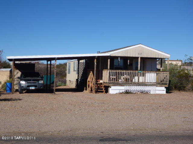 Cute and cozy! Kept very well and has had new steps built! Two sheds! Covered porch and parking with beautiful desert landscaping in back yard. Must see!