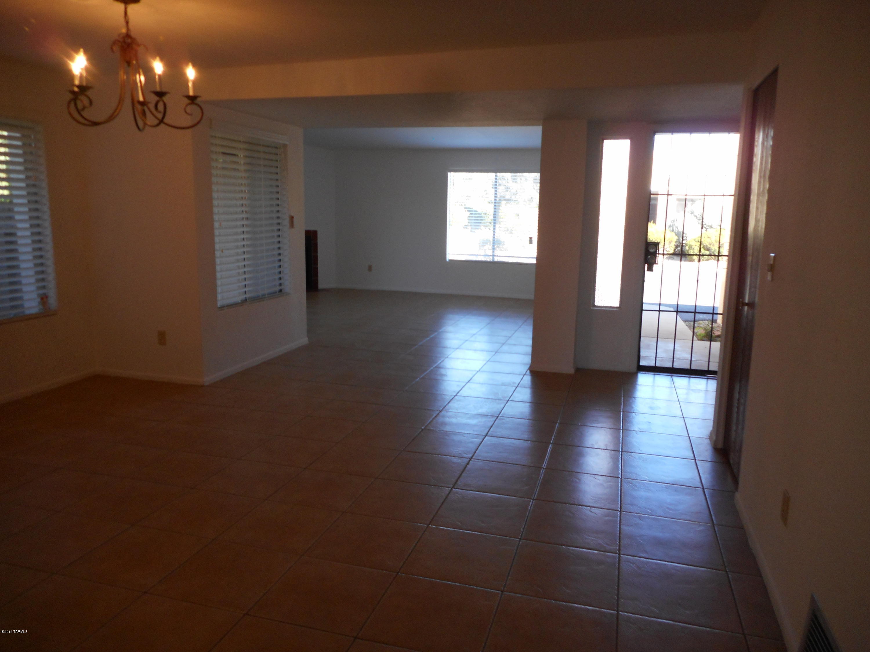 NW gem near shopping, Udall Park and Pantano River Walk.  3bed/2bath all tile townhouse with 2 covered carports. Just refurbished with new appliances, newly painted, fireplace, light and bright with skylights in both baths, plenty of closet and storage space, large private back yard with extended covered patios and HOA includes pool, tennis and basketball court.  Quiet community in well-maintained neighborhood - come see!