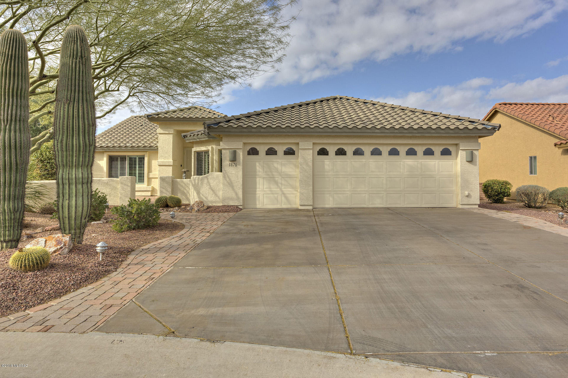 Expanded 3 Bedroom Laredo on large cul de sac lot, walking distance to all of QC amenities.  Extended 2.5 car garage with beautifully paved courtyard and fully extended covered patio.  Security doors at entry and patio access. Plantation shutters, tile everywhere except the bedrooms, 42'' warm maple cabinets, ceiling fans everywhere, newer appliances, all here at a very affordable price.