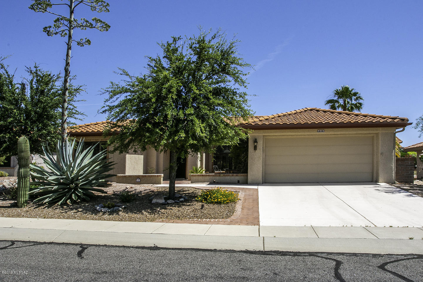Updated, expanded Silver Creek model. Spacious kitchen has Corian counters, tiled backsplash, & refinished cabinets. Interior has been painted with custom designer colors. Plantation shutters throughout provide privacy. Home is located on a large lot with mountain views. Backyard patio has water feature & custom built-in BBQ. Epoxy coating on garage floor, driveway, & walkways. Extra storage in garage. Roof replaced in 2011. Enjoy 2 swimming pools, 18-hole golf course, state of the art fitness center, lighted tennis & pickleball courts, variety of clubs, The Views Restaurant, The Gift Shop, & more.....  Close to medical facilities, shopping & restaurants.  Some furniture available on a separate bill of sale.