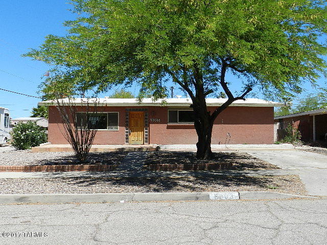 Great central location, close to it all! Great curb appeal with easy care landscaping and mature vegetation. Corner fireplace in family room. Kitchen full of cabinets and concrete counters. Great sized yard with separate workshop/storage.