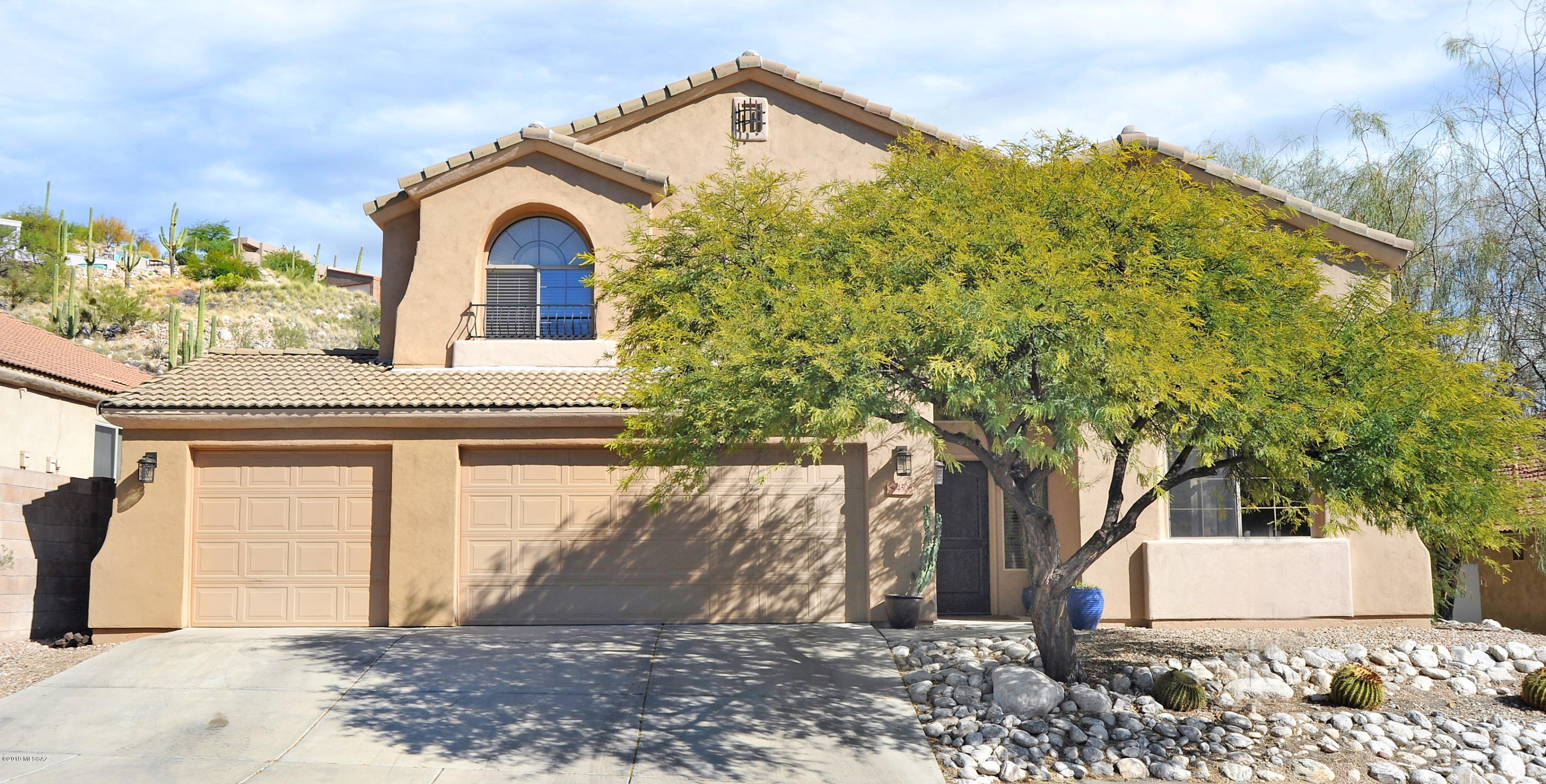 Remodeled 5 bedroom-3 full bath, 3 car garage home in the prestigious gated community of Sabino Mountain. Kitchen consists of Quartz Countertops, undermount sink, New Stainless Steel Appliances, Island with seating for 3,built in computer desk.Family room has a gas fireplace and a double glass door leading out to the backyard. Premium lot with great views. Extended covered patio. The master bedroom has a garden tub, walk in shower, large closet & in suite office. Mirrored closet doors.The balcony off of the master bedroom has incredible views.All three bathrooms have granite countertops, undermount sinks, and tile surrounds. Two bedrooms are located on the first floor with a full bath.  Beautiful rec center, heated pool and spa. Close to Sabino Canyon, Golf, restaurants, hiking, biking.