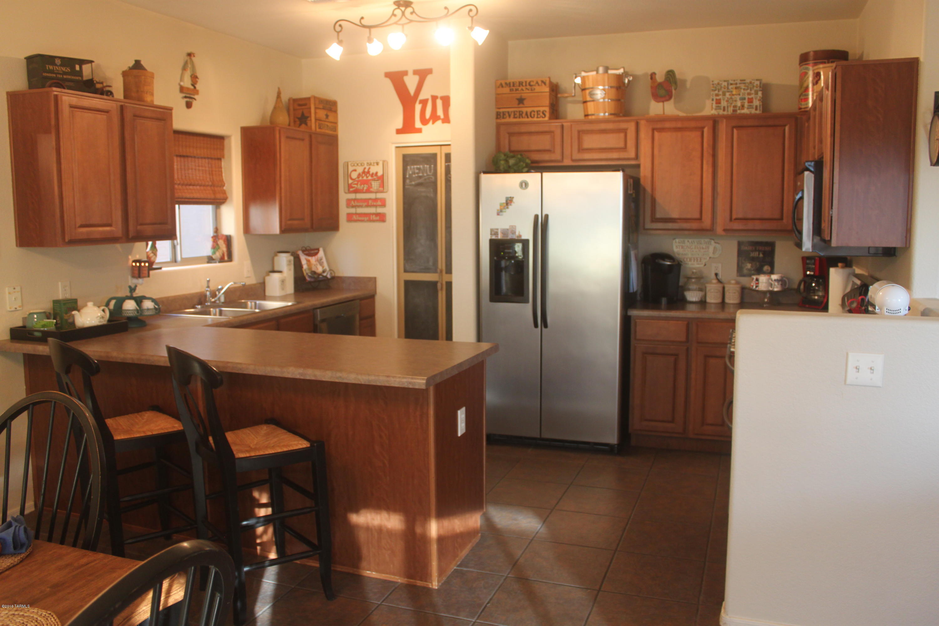 Great bang for your buck in this home located in desirable Vail School District. Backyard gate opens to community park with basketball hoops, playground, 1 acre open grassy field, dog park, and swimming pool. Almost 2200 square feet of living space with 4 bedroom and 3 bathrooms. Large loft upstairs and den downstairs. Put this one on your short list because it won't disappoint.