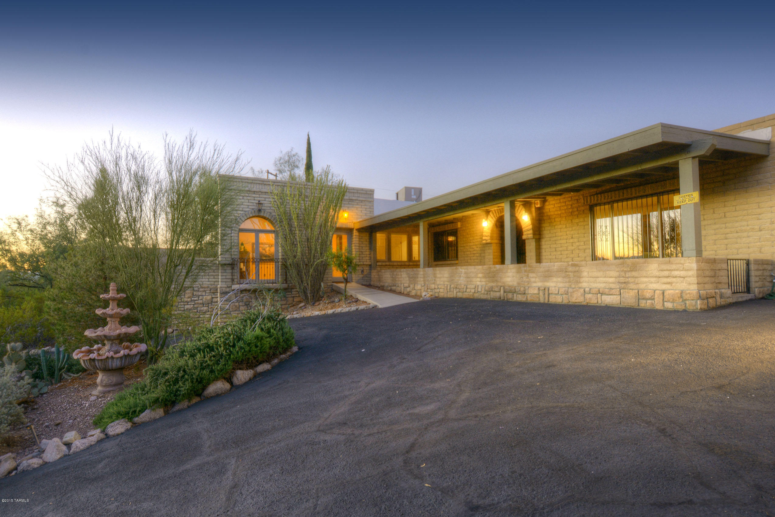Enter through privately gate to property perched high on a hill with 180 views of the city,  mountain ranges and sunsets.  The 3BR/2BA main house w/ 450' 1 BR guest house features imported floor tiles from Spain and Talavera tile from Mexico in all three bathrooms, wet bar, guest suite and master bedroom.  Main house has a spacious LR/DR and separate family room with a cozy fireplace.   The 25,000 gallon pool and spa are with Finger Rock views is perfect for entertaining.  ONE interior step but otherwise wheel chair adapted throughout!  Motivated Seller to provide $10,000 credit to buyer to make the property ''their own.'' Voluntary HOA!! -      Imported floor tile from Spain.
-      180% sunsets â€“ La Paloma views, city and mountain ranges
-      25,000 gallon pool displays Finger Rock mountain views from pool location