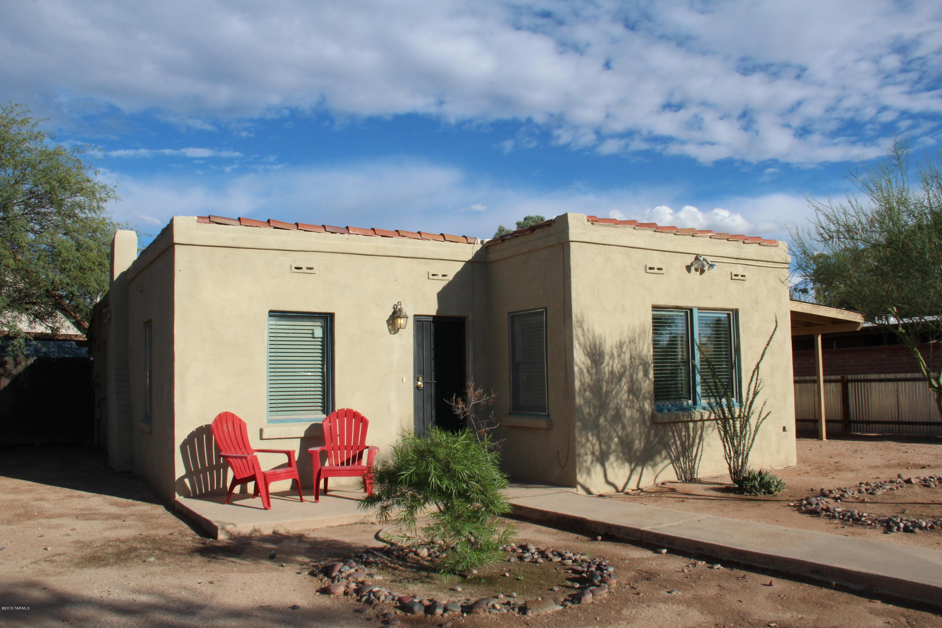 Classic Tucson Bugalow, tons of charm and still very functional layout that feels bigger than it is! 3 bedrooms and 2 bathrooms. Large Updated Kitchen with Gas Stove, Microwave, Dishwasher and Refrigerator. Washer/Dryer Included. Added Character with saltillo tile, Archways in Family Room and Dining Area, Great light and solid construction. Rainwater harvesting to water your trees, plants and room for a garden in this private spacious yard.  Clean as a whistle and move in ready.   Close to shopping, restaurants, busline and get to UofA in 10 minutes!  Amazing Value, schedule a showing today! NOT a REO or Short Sale, just a motivated seller.