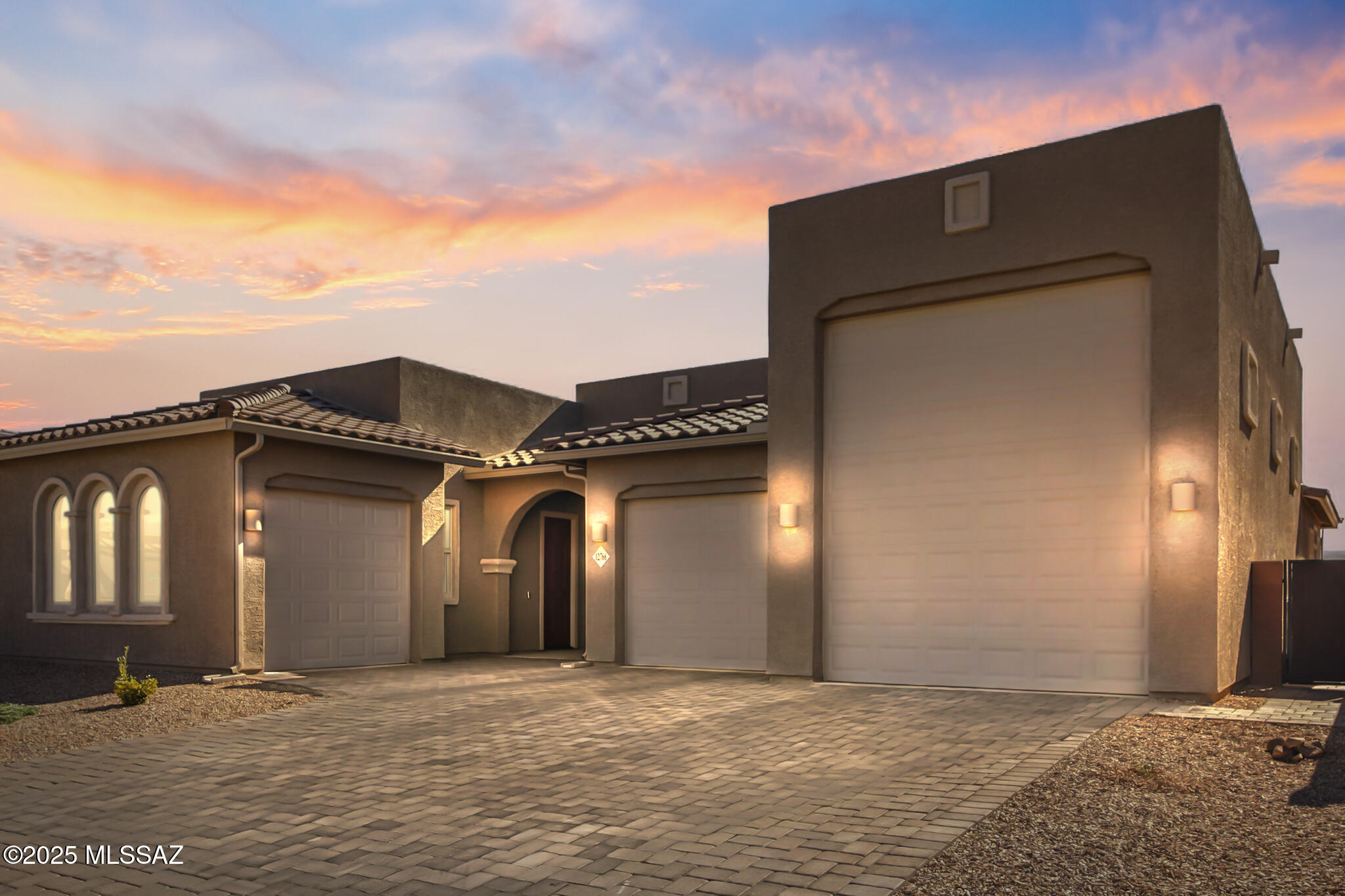 Set against the rugged beauty of Southeast Tucson, this home is more than just a place to live - it's a launchpad for adventure.  Tucked within the Rocking K Ranch community, it offers a peaceful desert backdrop while keeping you close to the best outdoor destinations Arizona has to offer.  Built in 2023, this flawless floor plan blends modern design with practical features tailored for an active lifestyle.  The oversized RV garage is a rare find - large enough to house just about any vehicle, toy, or gear you can dream of bringing along for the ride.  A next-generation suite with its own private entrance and garage adds flexibility, whether for visiting adventurers, multi-generational living, or a personal basecamp. Inside, you'll find upgraded touches like LED lighting throughout, a soft water system, and updated appliances.  A remote-controlled sunshade transforms the patio into an enclosed retreat, perfect for unwinding after a day on the trails.
From your doorstep, world-class outdoor experiences await; Saguaro National Park's iconic trails, the cool heights of Mt. Lemmon, the wonders of Kartchner Caverns, the history of Colossal Cave, and horseback rides through wide-open desert landscapes.
This isn't just a home - it's the perfect hub for exploring, adventuring, and living boldly in the Southwest.