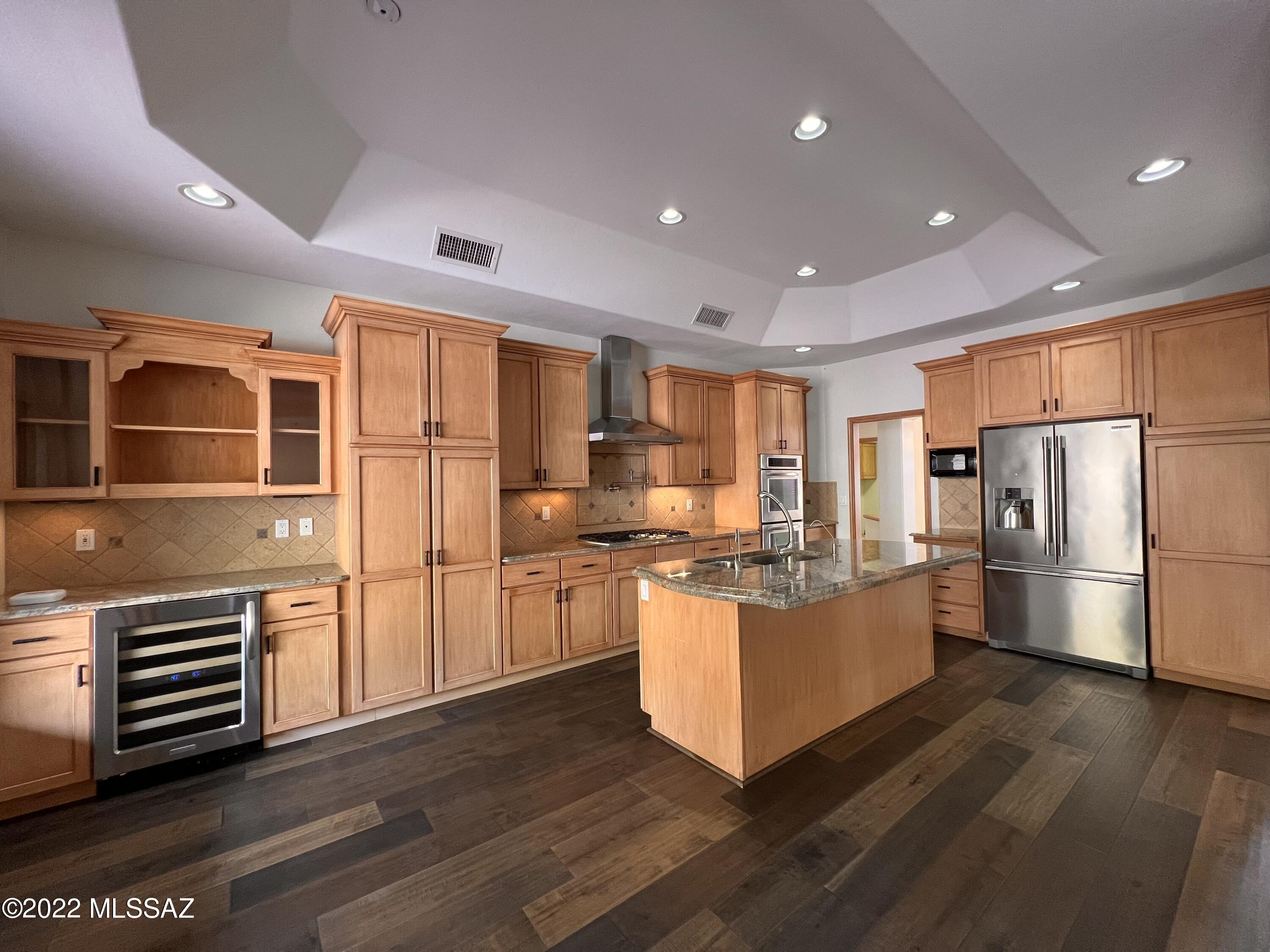 Stunning 3bdr/2.5ba home in the gated guarded community of Ventana Canyon Estates! Your courtyard welcomes you home with the sound of soothing fountains, gourmet kitchen features gas cooktop, double ovens, wine cooler, island, cabinets and counter space galore! Huge family room w/fireplace overlooks backyard. Fabulous primary suite offers bonus room overlooking the pool and spa! Split bedroom floorplan, two car garage, mountain views, sparkling pool, waterfall, built-in BBQ and so much more! This home is a MUST SEE! Pool and landscape service included.