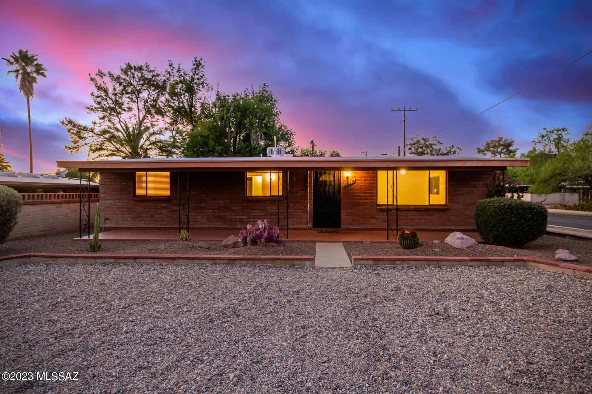 Adobe brick home on beautiful residential street w/ mtn views, wide streets with old growth trees, and well-kept neighboring homes. This home has been owned by one family, several generations, since it was built. This is presented for sale to the Market for the first time. Master bdrm has own entrance and en suite bathroom - rare find! New flooring, freshly painted throughout. Real wood cabinets, recessed lighting, vintage french door Frigidaire stove, skylights, stackable washer/dryer, Trane HVAC, Navien tankless water heater, Enviro Water Filtration, newish carport roof, & more - ask for details sheet for more info. Murphy bed/fold out desk a bonus! 2 carport parking spots, RV parking or extend yard in back, 3 guest spots out front, plenty of room for your toys! House conveys with original screens stored in carport storage and kitchen closet has all the vintage knobs/fixtures for mid-century lovers!