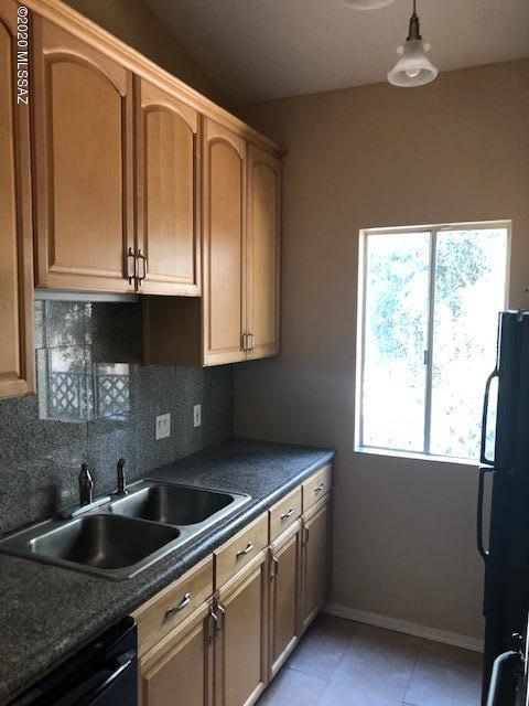 Beautifully remodeled unit in desirable Langley Gardens. Updated kitchen with 42'' upper cabinets, granite tile counters, fridge,gas stove, microwave & dishwasher. Updated bathrooms with ceramic tile floors, and back splash. Brand new toilets.Freshly painted interior, brand new interior doors w/hardware.Cherry wood laminate floors in common spaces and brand new carpet in bedrooms. Updated light fixture and ceiling fans. New dual pane windows. Spacious balcony with storage. HOA covers structural  insurance,exterior maintenance,roof, pest control,hot water, trash,water,2 pools(1 heated) and more. North/South orientation, Trees!!!!