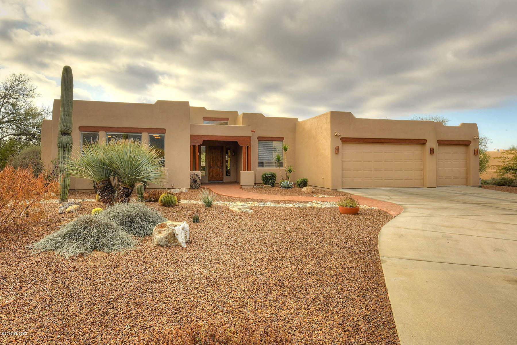 OUTSTANDING 3056 SQ FT, 4 BR/ 2.5 BA t DEN & 450 SQ FT GAMEROOM (COULD BE A VERY LARGE 5TH BR) CUSTOM SANTA FE  IN LOVELY WINCHESTER RANCH!  HM BOASTS AN OPEN GREAT ROOM SPLIT FLOORPLAN, STAINLESS STEEL APPLIANCES, GAS COOKTOP, DOUBLE OVENS, CENTRAL VAC, COZY GAS BEEHIVE F/P, CHARMING  BEAMS/CORBELS, VAULTED CEILINGS, OVERSIZED 3 CAR GARAGE W/ STORAGE &  BUILT-IN WORK BENCH PLUS A GREAT LOCATION AT END OF CULDESAC. YARD IS AN OASIS W/  HUGE SHADY COVERED PATIO, FENCED SPARKLING POOL/SPA PLUS GRASSY AREA, FIREPIT & CUSTOM LIGHTING. LOT BACKS WASH W/ MANY  MESQUITES &  HAS  GREAT VIEWS OF THE CATALINAS & THIMBLE PEAK! HVAC IS  5 YEARS OLD , EXTERIOR HAS BEEN RECENTLY PAINTED &  ROOF COATED.  CLOSE TO KID & DOG FRIENDLY MCDONALD PARK. THIS HOME HAS BEEN IMPECCABLY MAINTAINED & IT SHINES!