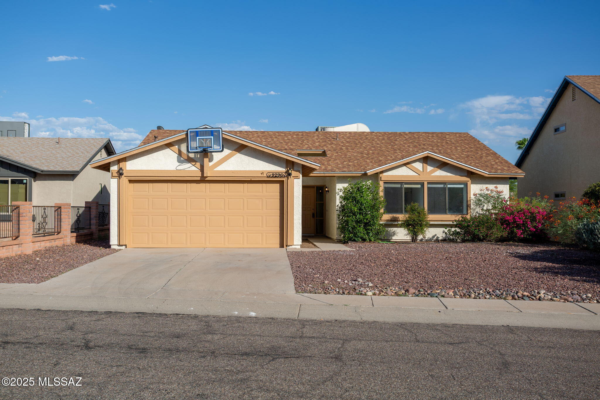 Quick move in and NO HOA FEES.  FREEDOM to do what you want with this Doll House Home that is ready to occupy IMMEDIATELY.  Great location and neighborhood for those who need extra space for parking.  Great curb appeal - 4 large bedrooms & 2 baths.  Living room with fireplace, dining room with patio door leading to large blank pallet rear yard with covered patio, all backing to large open space with MOUNTAIN VIEW of those beautiful CATALINAS  and all the privacy you crave.  Conveniently located for easy access to I-10 freeway, Mountain View H a, Arthur Pack  Regional Park, Walgreens & much more.  Newer HVAC, ROOF and all in great condition.  Tall ceilings give a feeling of space & an open feeling.  Kitchen has great cabinets, all appliances & a place for ample seating in dinette & lounge