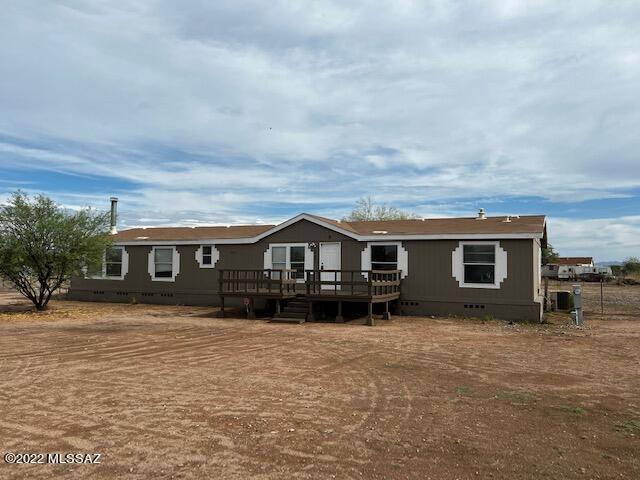 Spacious 4 bedroom/2 bath affixed manufactured home on just over 1 acre with New Exterior Paint! Open great room floorplan with vaulted ceilings & fireplace. Updated kitchen has plenty of cabinet space and an island, breakfast bar Stainless Steel appliances including a gas range. This home won't disappoint. Newer carpet & laminate flooring. Oversized main bedroom suite has huge walk in closet plus large bathroom with soaking tub and separate shower. 3 guest bedrooms and a bonus room can be used as a den, office or playroom. Large back deck for relaxing & enjoying the sunset & mountain views. Partially fenced yard, large storage shed and play set. Conveniently located close to schools. This home will not last long. Come see it before it's gone!