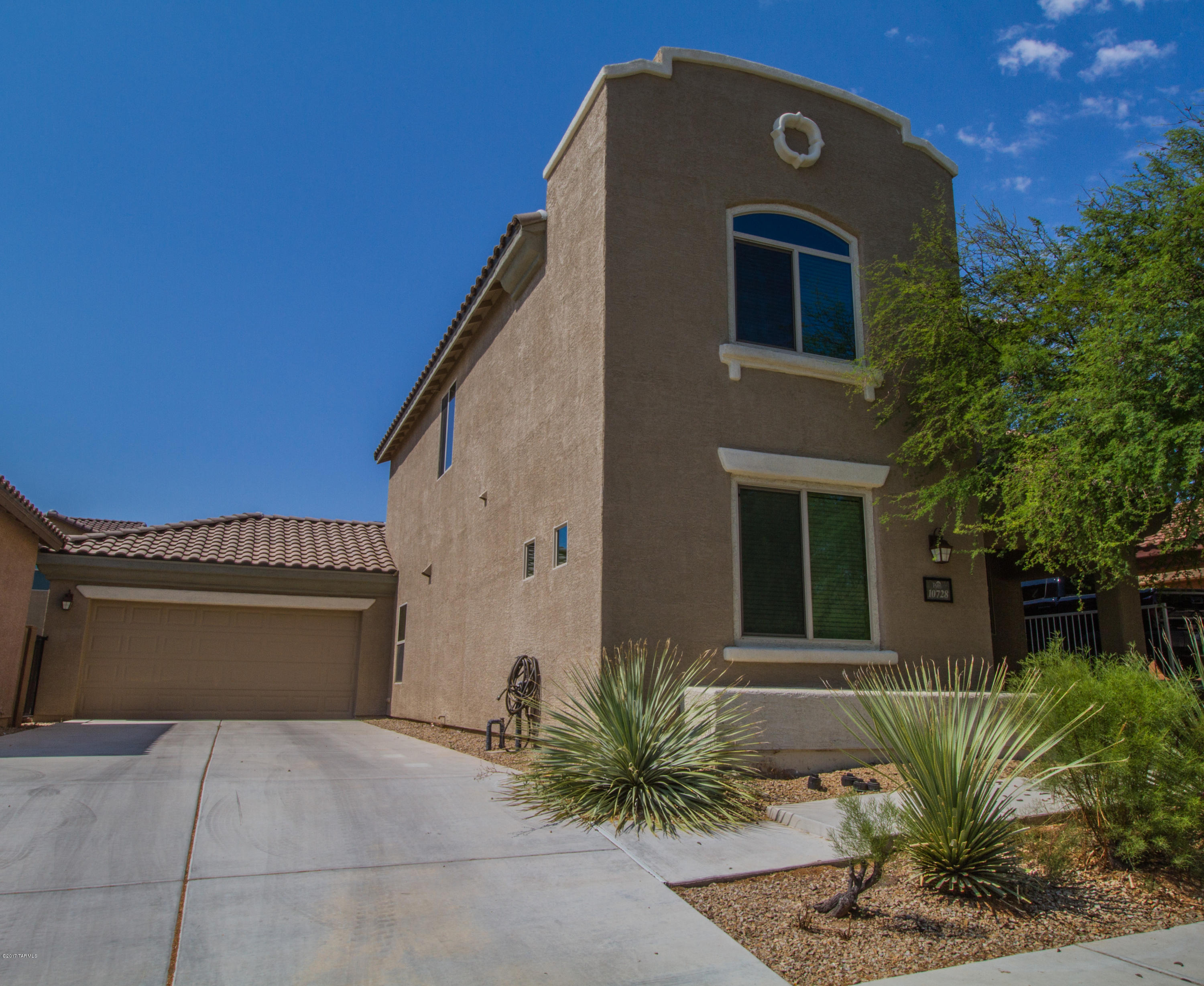 Stunning, immaculately maintained Like New Sierra Morado home! Home boasts a bright and spacious floorplan, neutral interior palette, and an abundance of upgrades!Gorgeous gourmet kitchen features stainless steel appliances, Corian countertops, plus island and breakfast bar! Open dining area and living space make this a terrific home for entertaining. Downstairs you will also find a guest bedroom and full bath! Three additional bedrooms and two bathrooms upstairs, including the spacious master suite! The ample backyard makes a great outdoor entertaining space with covered patio and low-care landscaping. The community boasts four miles of trails, a junior Olympic size lap pool, 2 basketball courts, and is in the highly desired Vail School District!