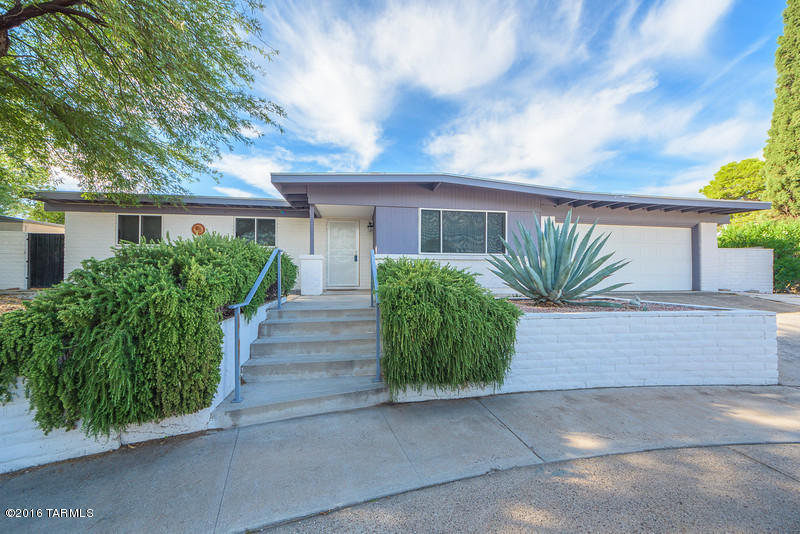 Beautiful house on a quiet cul-de-lac, close to shopping, and many other facilities. This must see house is featured with a elegant updated kitchen, granite tile countertops, cherry cabinets and many more additional features. Updated bathroom with Jacuzzi tub. kitchen and bathrooms have 4 Solatubes providing ambient lighting for entertaining . The front of the house has Impenetrable Security Screen Master screens, but the rest of the house has security bars. The two car garage contains custom built cabinets. Water softener and two storage sheds in the back yard, large side lot with water fall and fire pit, near the covered patio. This house is move in ready and great for entertaining family and friends!!!!!!!!!!!!