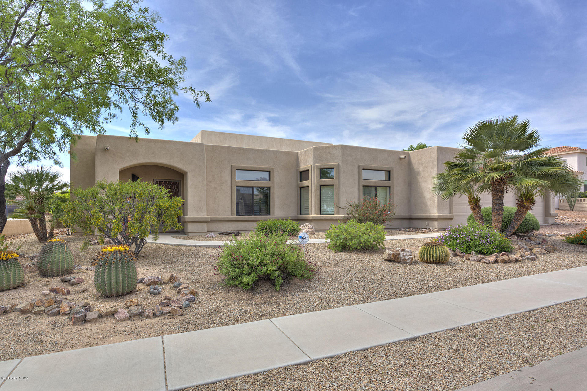 Looking for more space, style and quality in one of Sahuarita's most desirable neighborhoods? Here's the home for you! Fabulous custom floorplan w/soaring ceilings, tile floors in all areas except bedrooms.Huge living room; kitchen features granite slab counters, tons of cabinets, stainless appliances & center island. Master suite w/wood-look ceramic tile, private door to back patio, master bath w/walk-in tile shower, large double sink vanity.  Beautiful Murphy bed in 3rd bedroom gives option to use the room as a den or bedroom! Extended covered back patio& huge backyard w/built in BBQ kitchen, waterfall/pond, fire pit & plenty of room for a pool. All appliances, window coverings and ceiling fans included. All that PLUS an extended 3 car garage w/storage space galore. Sure to sell quickly!