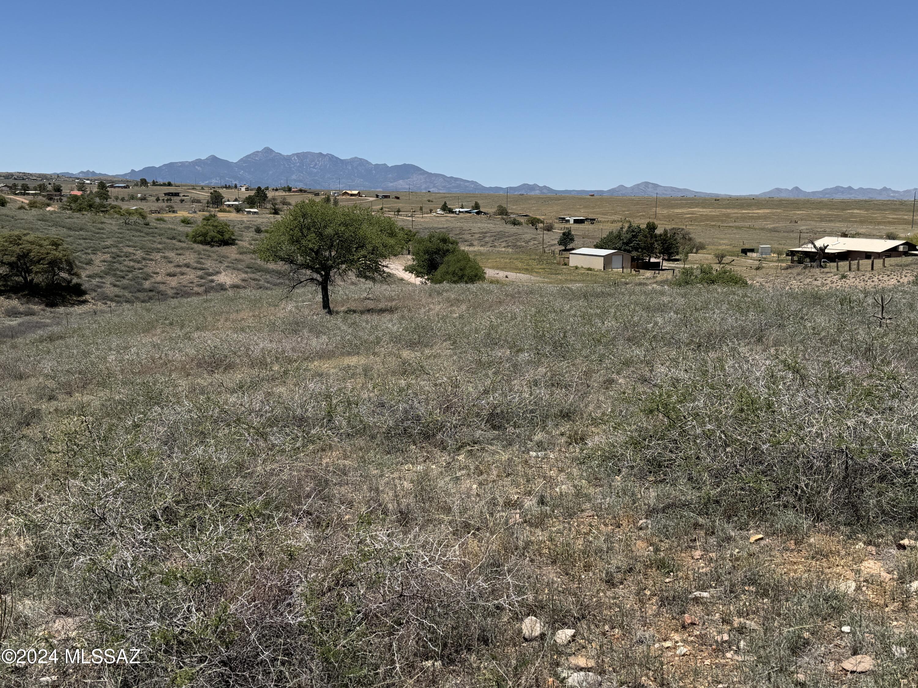 Looking for a serene and picturesque location to settle down? Look no further, this wonderful 4.76 acres in the Mountain Empire of the Sonoita Valley. With its breathtaking panoramic views & tranquil atmosphere, this location is the perfect place to call home. It is located close to Copper Hop Ranch & Microbrewery with delicious beer & small bites, and Lightning Ridge Winery, specializing in Italian grapes, with a tasting room & outdoor seating. Parker Canyon Lake where you can go fishing, swimming, boating, kayaking or hiking in the beautiful scenery is a 35 min drive. This property is fully fenced, includes incredible views, a private well, 2 sheds, and many oak trees.
