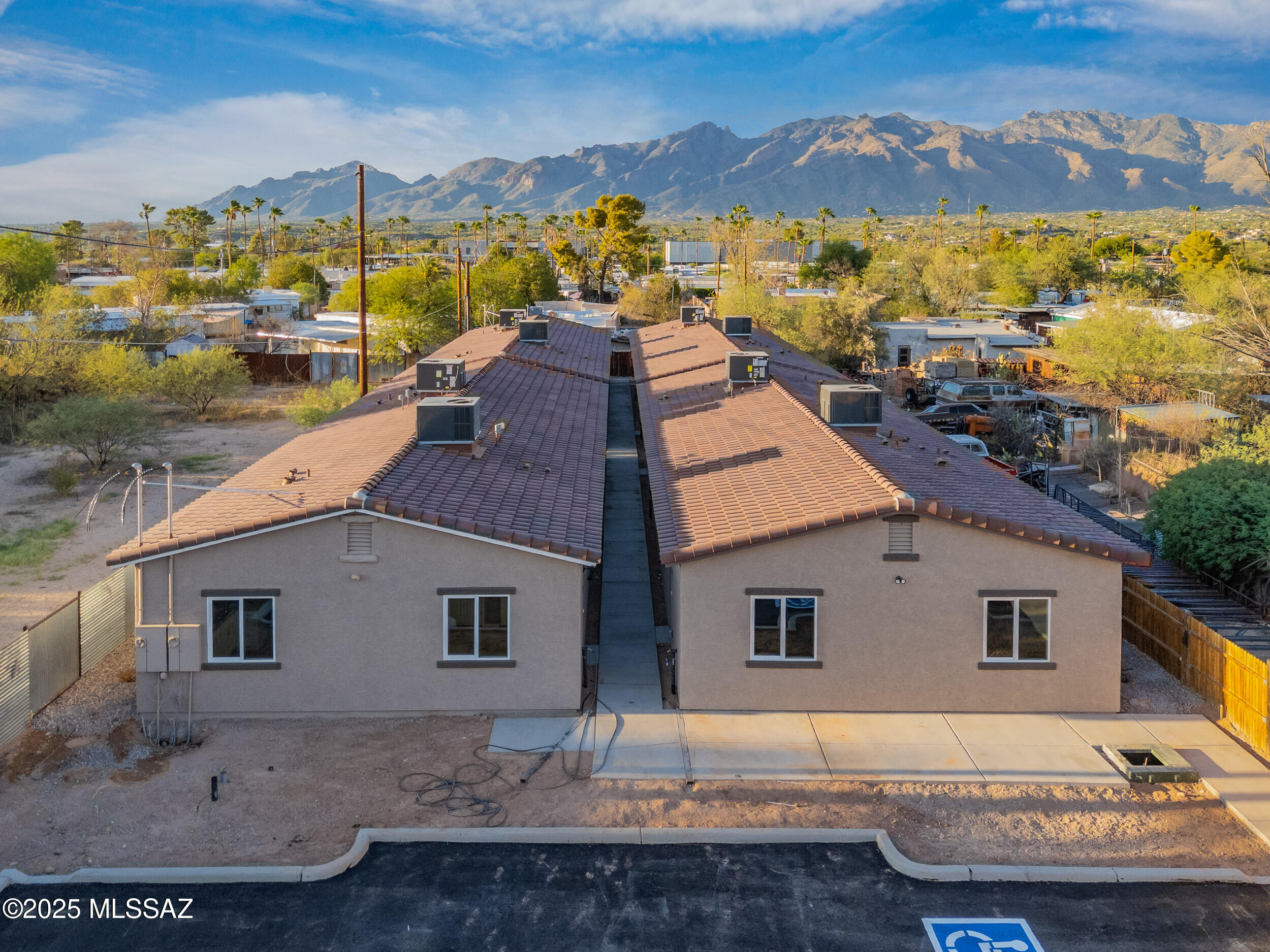 INCOME GENERATING PROPERTY * *  *.  *   *  *  4 NEW CONSTRUCTION DUPLEXES.
-Four units 3 Bedroom 2 Bath 1079 Sq Feet  and   -Four Units 2 Bedroom 1 Bath 803 Sq  Feet. Total of 8 Units.
Great Investment opportunity ! Beautiful Granite counters through out home, new stainless steel appliances, tile in all areas.  Parking lot with EV Ready Outlets.  Close to University of Arizona 
and  I-10 for easy commuting as well as shopping around the corner.
