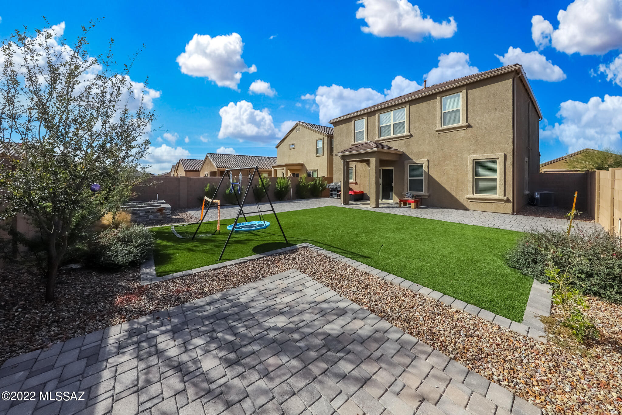 Don't wait for new construction! This lovely 2020 built home (Tyler floor plan) is ready for you NOW! The great room concept offers plenty of room for all! Custom painted kitchen cabinets, floating shelves, ample granite counter space, island seating; SS appliances. The first floor also has an office/bedroom with a custom-built barn door. Upstairs you'll find 4 bedrooms, 2 full baths, laundry & a loft offering additional flex space. Open the sliding door to the backyard and you'll find it upgraded w/a large area of artificial turf and extensive brick paver patio areas. Don't miss making this home yours! Make a showing appointment today.