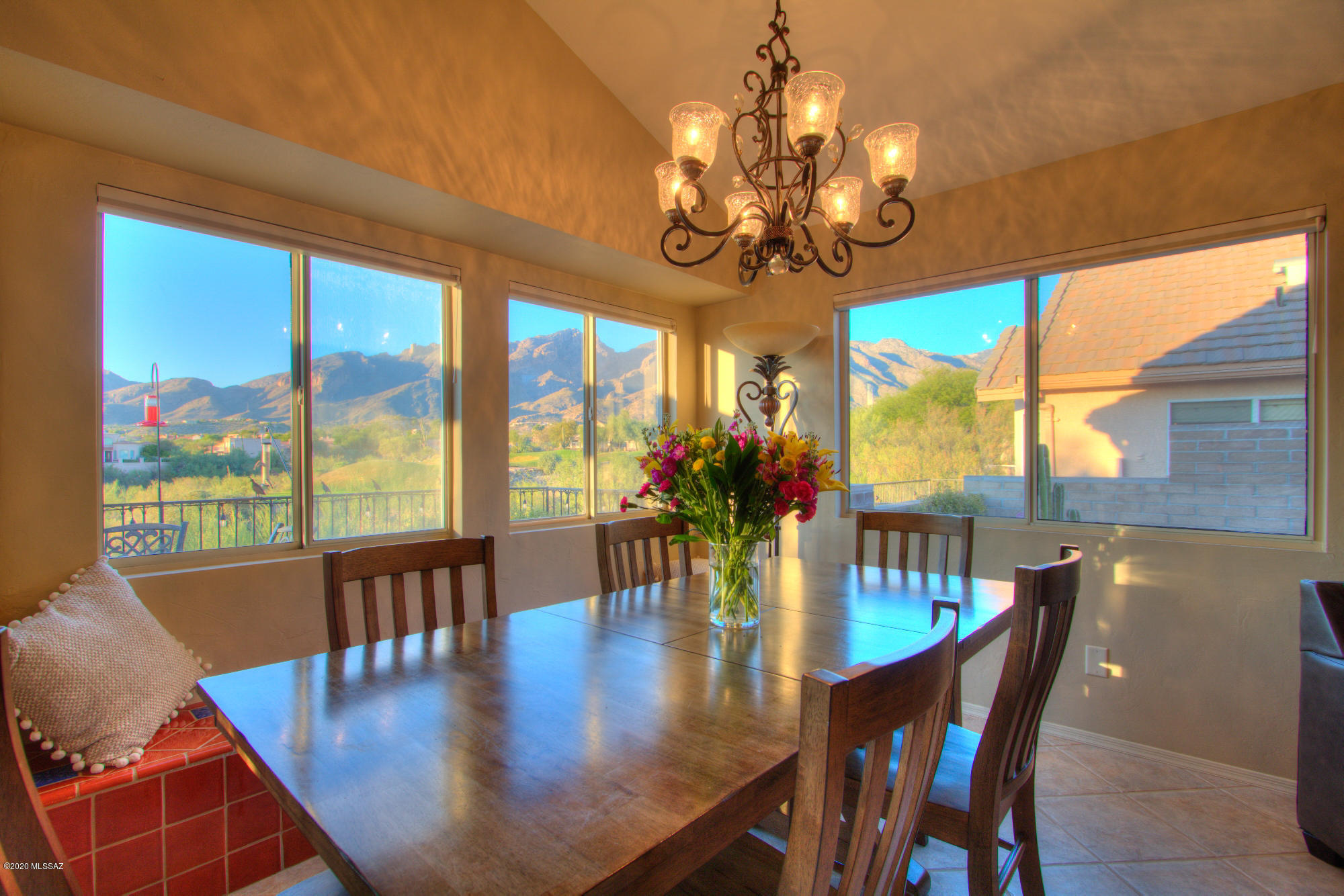 Don't miss this inviting updated home in a sought after Foothills location! Beautiful end unit overlooking La Paloma Golf Course w/spectacular Catalina Mountain Views! The formal entry opens up to a large living room w/vaulted ceilings & surrounding windows overlooking the spectacular view. Touches of Mexican tile for extra charm surround the fireplace and bay window seats. Updated kitchen w/cherry cabinets/granite counters/stainless appliances. Tile flooring throughout. Great split bedroom plan w/two spacious bedrooms & the 3rd bedroom currently being used as a den. Light & bright. Exterior recently re-painted & large maintenance free deck replaced. Relax and enjoy dramatic sunsets and star gazing from the deck! Move-in ready & perfect as either year round or second home.