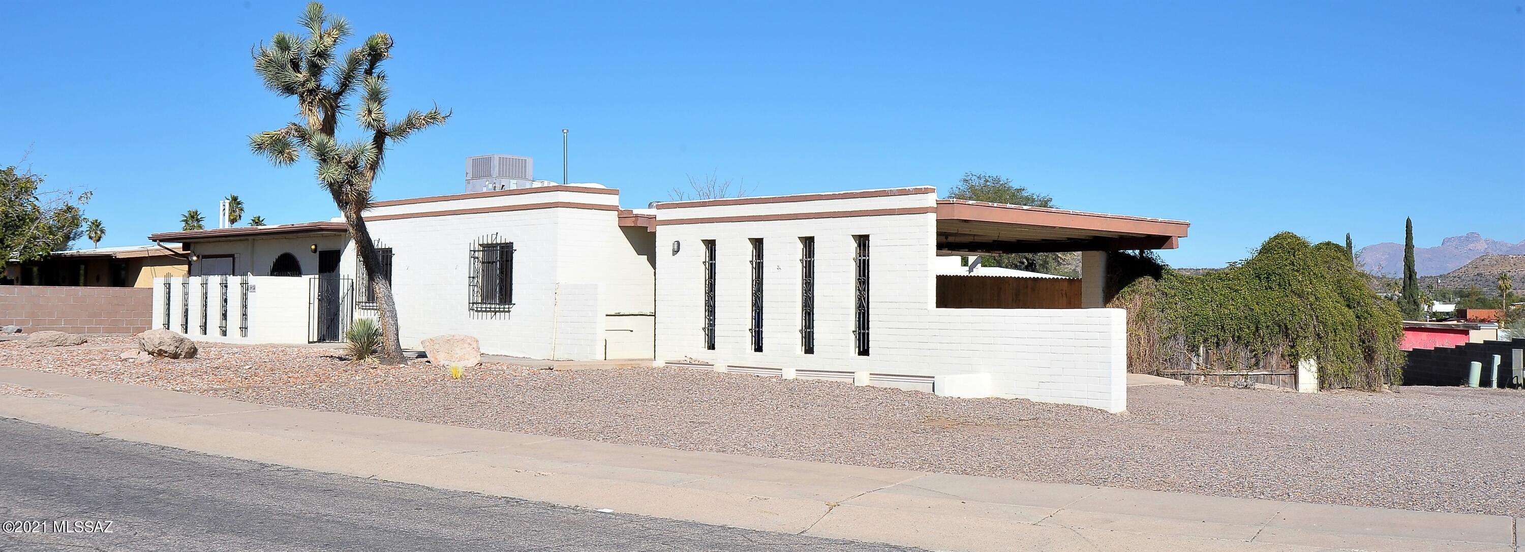 Rare find with incredible income potential! Large .34 acre lot with house & a guest house!  Main house 1706 SQ.FT. with 4 bedroom/2 bath plus a den has tile everywhere except 3 bedrooms with new carpet.  836 SQ.FT. Guest house has a living room off kitchen and a bedroom & bath.  Great mountain views from the back patio and yard.