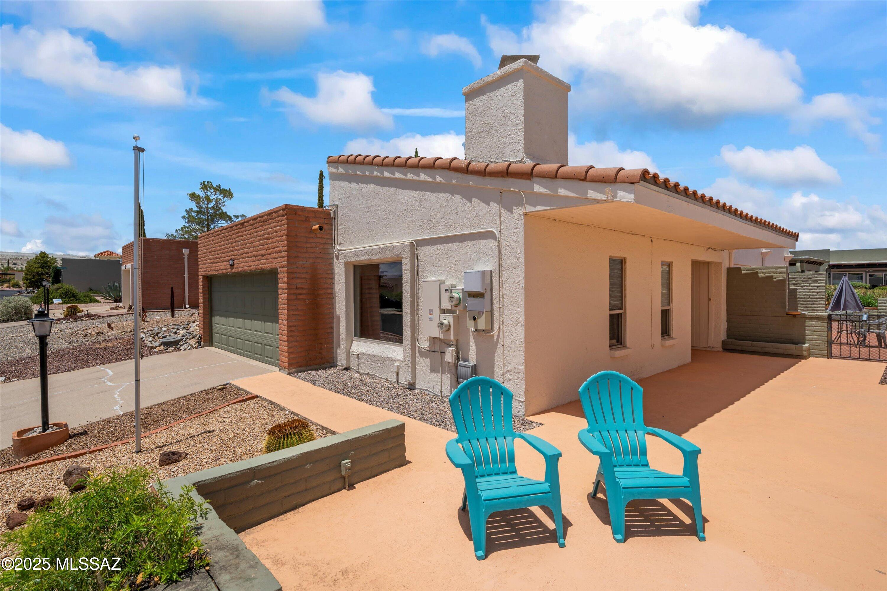 This Home is a Treasure; A Single Family Home in Beautiful Desert Hills 2. Elevated lot, w/Front Patio Views of Santa Rita Mountains. Plenty of Outdoor Living Space Front & Backyard. Enter Foyer w/Natural Light Atrium; Great Room, Kitchen or Access to Dining Area. Recent updates added. The Great Room Boasts a Beehive Firelplace & Views out the Picture Window. A Separate Dining area w/Slider to Side Patio/Great outdoor living space. The Kitchen w/Breakfast Nook + Breakfast Bar. Laundry Room is Spacious, W/D included w/Great Storage Capacity. Main Suite is Roomy w/Slider to Beautiful Covered Patio. Main Ensuite w/Shower & Linen Closet. Guest Room or Office is Perfect workspace. Hall or Guest Bath w/Tub & Shower. Newer Skylights have been replaced, and Solar for lower electric bills. Step outside to the front patio to savor breathtaking mountain views that promise a new picture-perfect sunset every evening. A beautiful back patio for privacy and views, easy access from the hallway or primary bedroom. "Ready for move in, Make this your home."