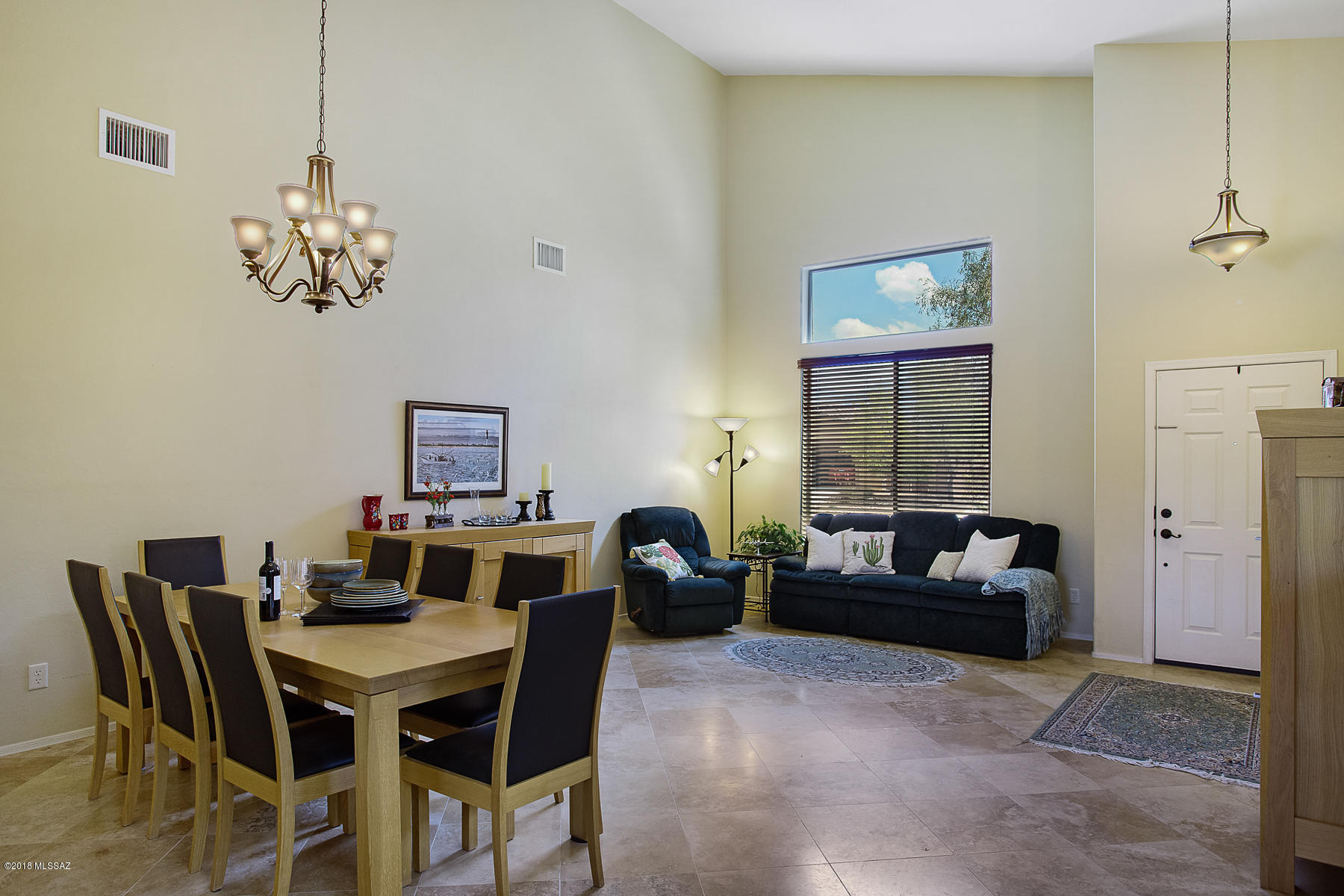Don't miss this spacious Verde Ranch home! The backyard is an entertainer's delight, complete w/built-in grill, fire pit w/seating & a beautiful pool/spa. Backs to natural open space, providing a lush desert view & privacy. Enter in to the large formal living/dining area that includes a built in bar area. Large family room off of the kitchen that overlooks the backyard. Abundant counter/cabinet space, including a separate pantry. Guest/in-law suite w/bath & access to the pool & outdoor space is situated off of the kitchen. In addition to the   3 BR/2BA, the upper floor has a large loft area that is perfect for a play area or home office. There are pocket parks within the subdivision. Convenient to shopping, restaurants and other amenities.