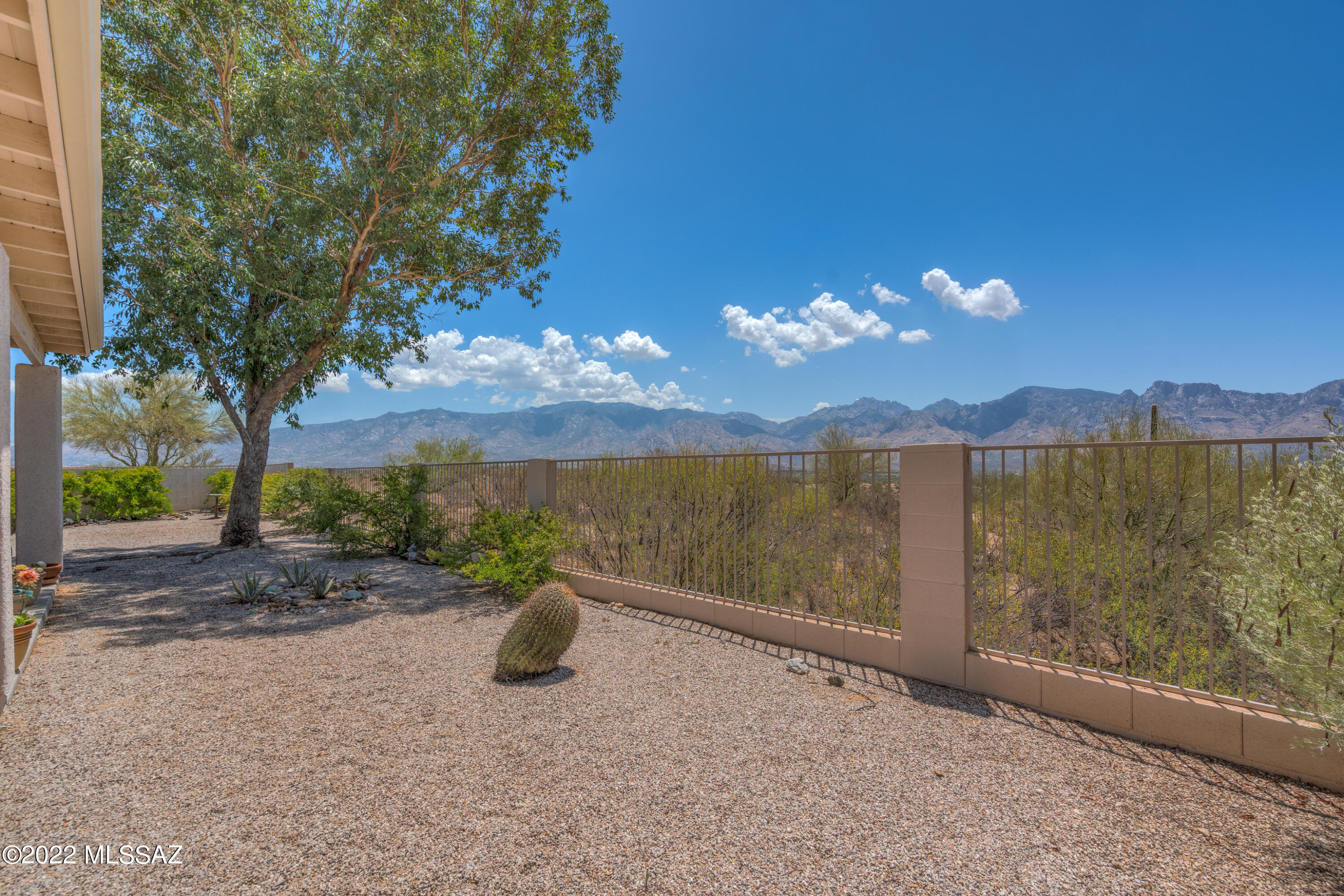 Views, Views, Views! Beautiful 4BD/2BA (1,980 sq ft)  home in a gated subdivision on premium cul-de-sac lot. Enter & find a great room w/gas fireplace and stunning picture views of the Catalina Mountains! Gourmet Kitchen w/center island boasts granite counters, under cabinet lighting, elegant tile backsplash, plus breakfast bar and nook! Master Suite w/double door entry hosts private backyard access, soaking tub & separate shower, plus dual vanities & large walk-in closet! Down the hall find 3 spacious guest bedrooms & a guest bathroom w/shower & tub combo plus dual vanities. 2-car garage features utility sink plus built in counter/cabinets. Rear yard backs up to open desert w/the most breathtaking unobstructed Mountain Views! A must see. *Furniture available on separate bill of sale