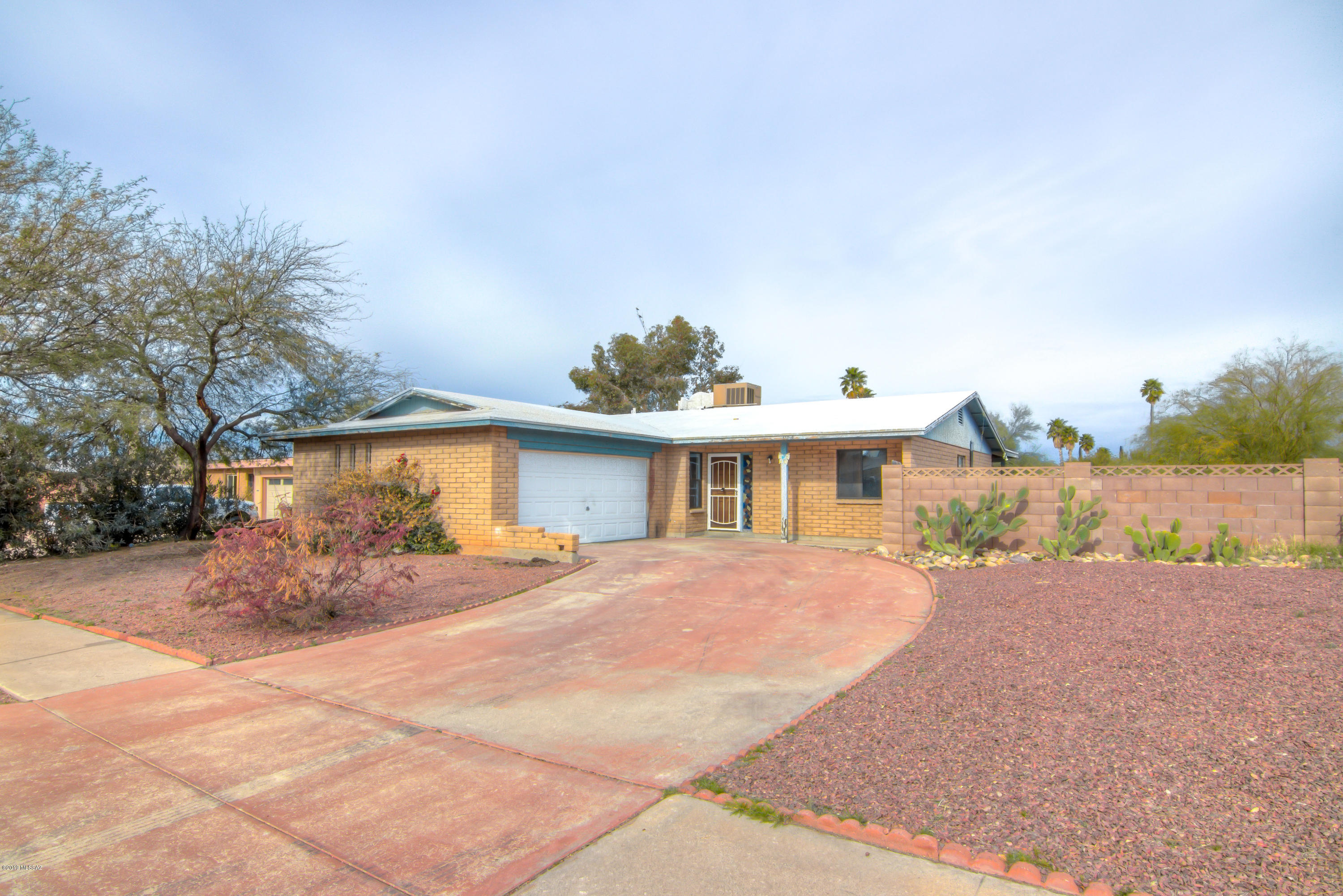 FIX UP HOME PRICED TO SELL! Home sold ''AS IS'' seller will do NO repairs. Priced below market to take into consideration the cost of repairs. 3 bedroom, 2 bath brick home. 2 car garage. Minutes from ''The Loop'' Bike and Walking path. Google it ''The Loop Tucson''.  owner/agent