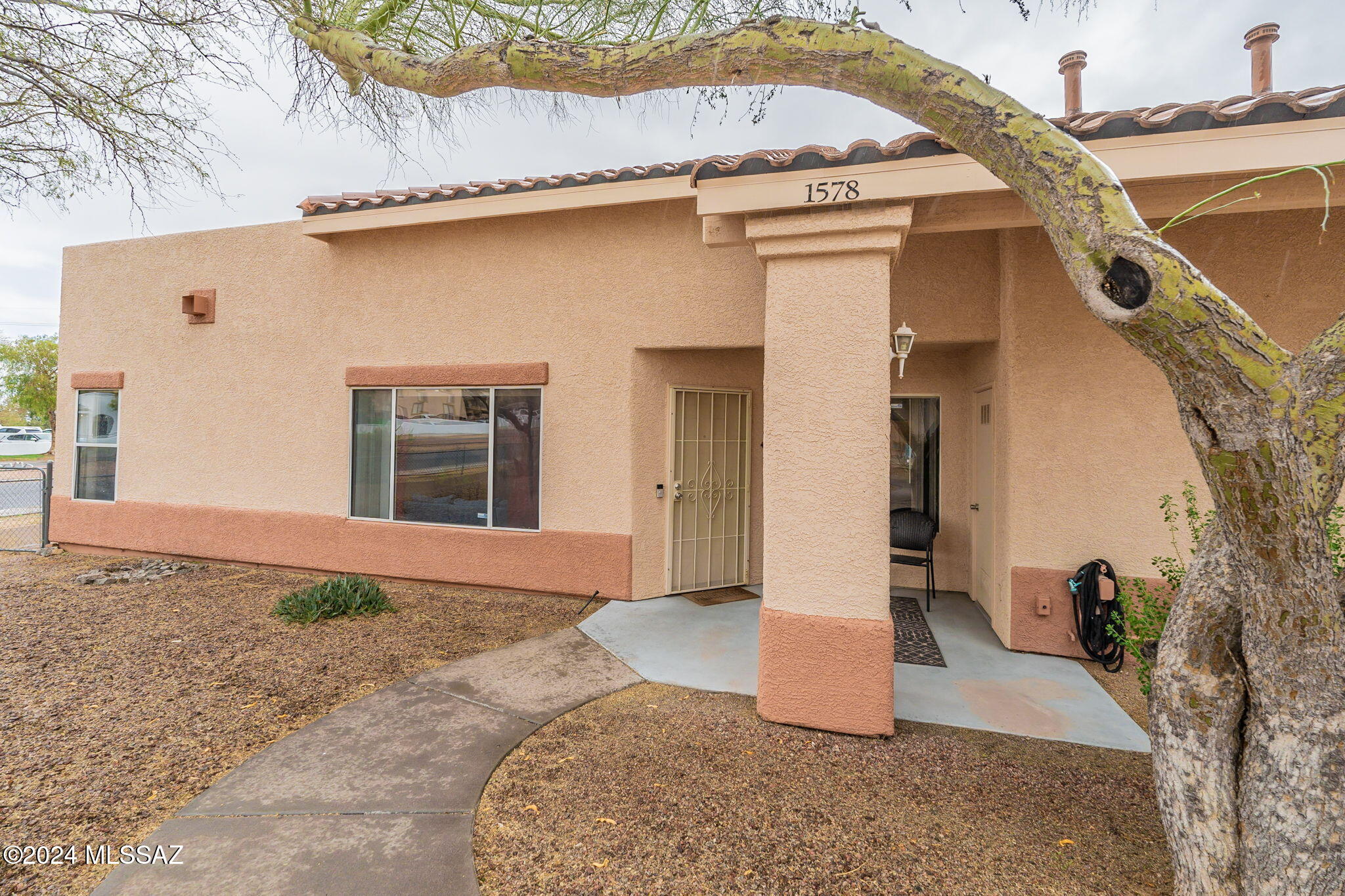 This is the perfect starter home, investment property or winter getaway! NO GVR but available! Open floor plan has 9' ceilings and oversized windows to let in loads of natural light. Kitchen has breakfast bar and separate dining area which opens up to spacious covered back patio, adding extra living space. Large master suite with walk-in closet. Guest bedroom also has a walk in closet and own bath. Laundry located in oversized 2nd bath. Community Pool with spectacular views of the Santa Rita Mountains! Centrally located easy highway access, walk to farmers market and rec centers!