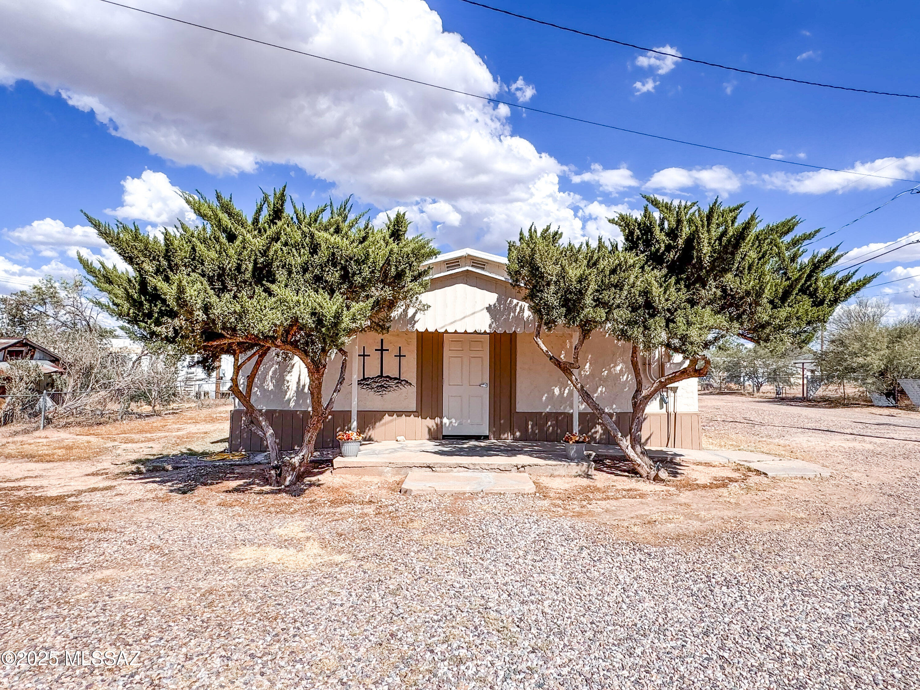 Endless potential with this versatile property directly across from Lions Park in Benson. Currently used as a church, the building offers new insulation and drywall throughout, three mini splits plus a gas furnace for year-round comfort. Features include two bathrooms, storage space, and excellent business curb appeal. Street parking adds convenience for visitors. With its prime location and recent updates, this property is ideal for a wide range of uses—bring your vision to life at 450 N Adams St.