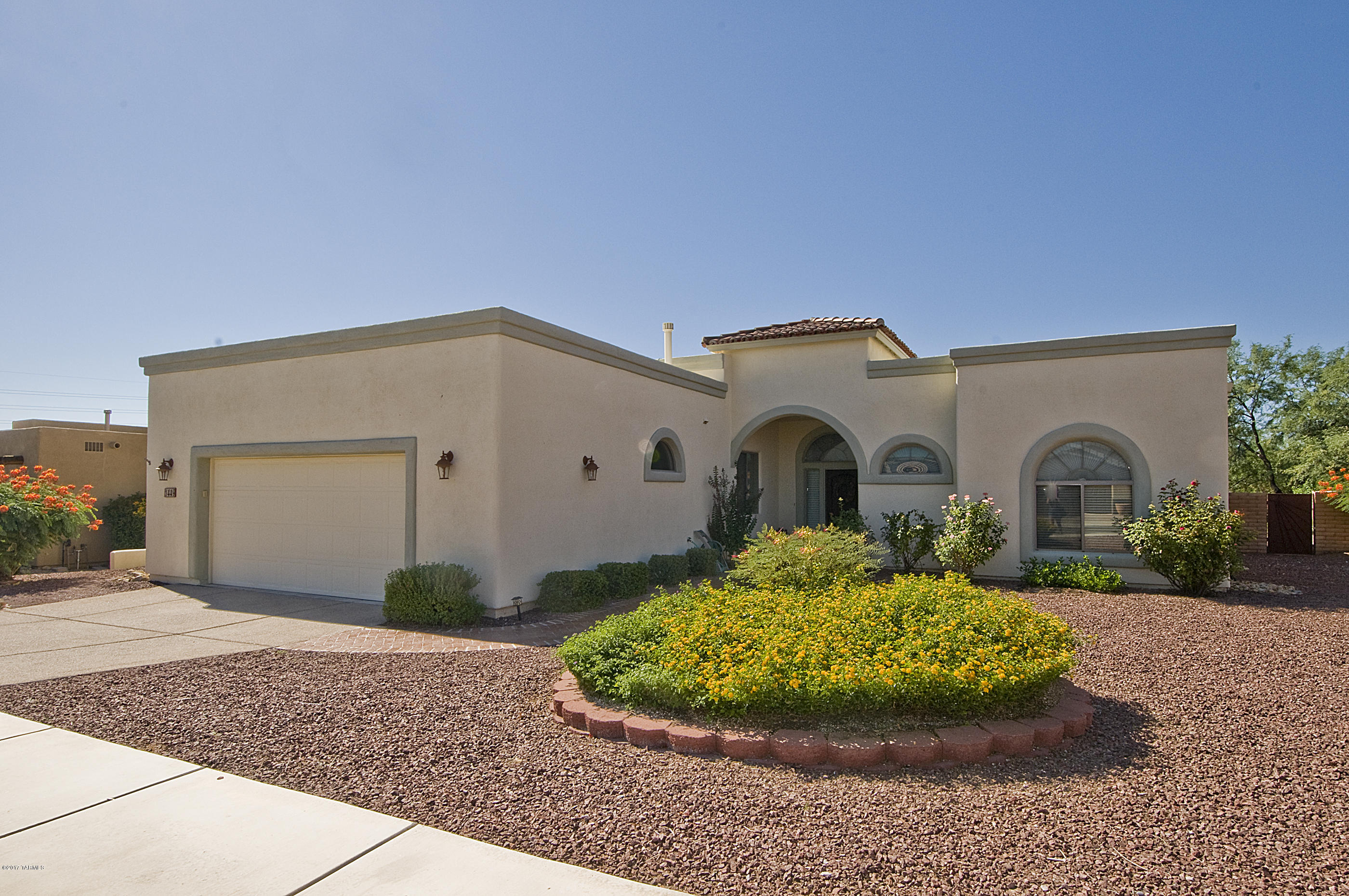 SELLER TO CONTRIBUTE UP TO $2,500 TOWARDS BUYER'S CLOSING COSTS WITH FULL PRICE OFFER!! Amazing opportunity to own a custom home in this beautiful enclave community! Close to everything Sahuarita has to offer but with room to roam at just over a .25 acre of landcaped beauty. This home has been meticulously cared for and shows like a model. The floorplan flows smoothly with a great room (w/fireplace), 2 dining area options, huge kitchen with plenty of cabinets and separate pantry. Generous master bedroom with Bay window, his and hers sinks, walk in closet and tiled shower. Large laundry room, covered patio, extra room in garage with cabinetry, common area behind the low care/beautifully maintained back yard with room for a pool.