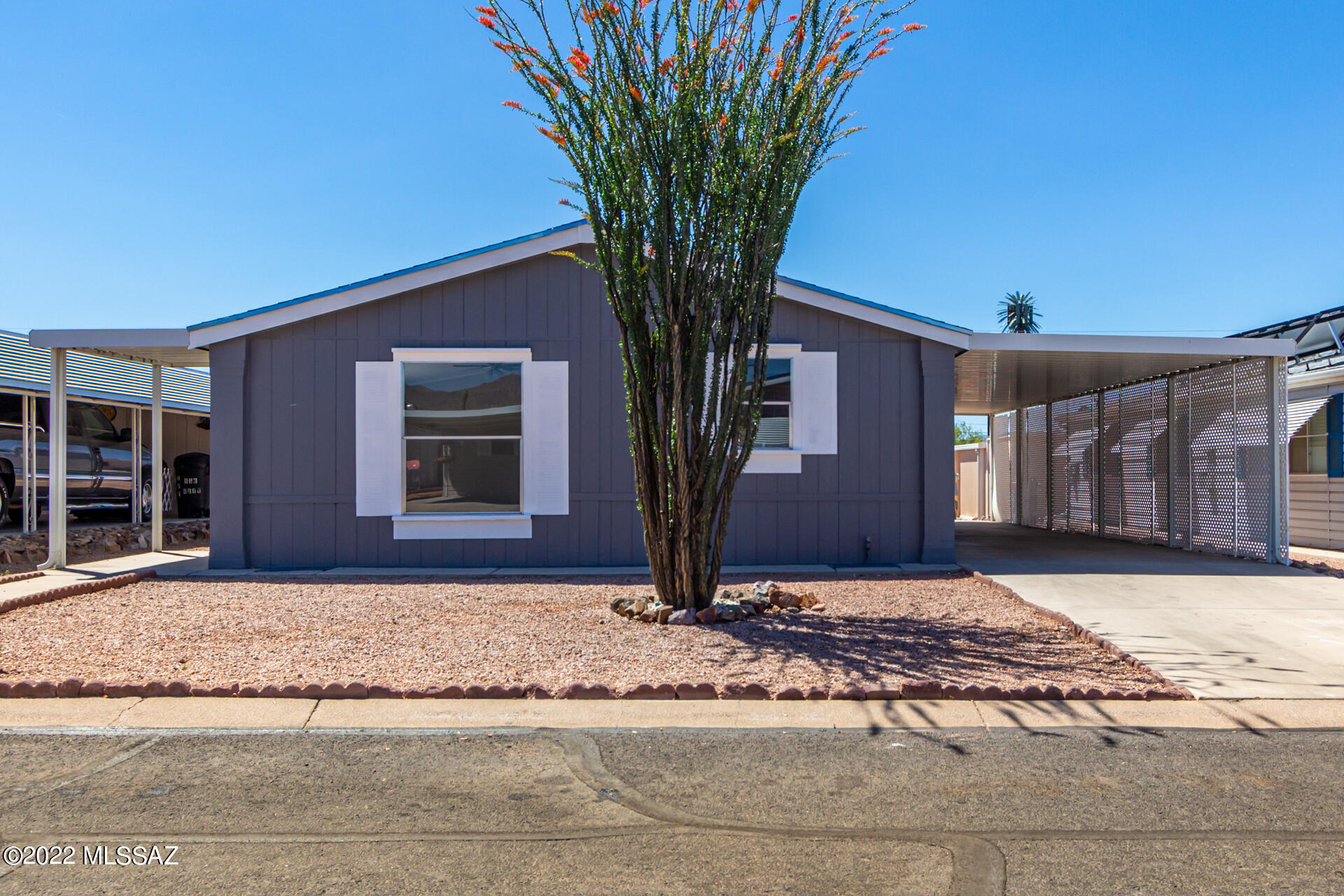 Come and see this charming 2 bed, 2 bath mobile home now on the market! Carport parking and low maintenance landscape! Located in a wonderful Adult Community w/everything from a refreshing pool to a fitness center! Inside you will find an open floor plan w/vaulted ceilings, elegant wood-look floors, and neutral palette throughout. The quaint kitchen is comprised of white cabinetry w/crown moulding, a pantry, speckled granite counters, SS appliances, and a peninsula w/breakfast bar. Enjoy a good night's sleep in the primary bedroom, featuring soft carpet and an immaculate ensuite. Your new home is waiting for you, hurry and schedule a showing today!