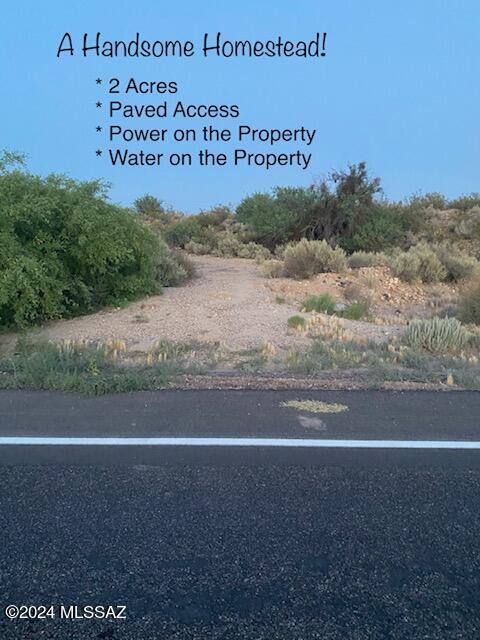 Awesome Building Site!  Elevated Views! Adjacent to State Land! This parcel gently rises up from the paved street (Cottonwood Wash Road) to a nearly-flat-to-slightly-sloping potential building site.  From this elevated portion of the parcel you can enjoy beautiful vistas of the Graham mountains and the surrounding foothills.  Given the height of your building site above the public road, and the fact that the north and east boundaries of the property are adjoined to state land, it is unlikely that these awe-inspiring views will ever be obstructed.  Electrical Power runs along the east boundary and a water service line has been extended onto the property.  Beautiful Views, combined with instant access to public lands makes this a Perfect Building Site!