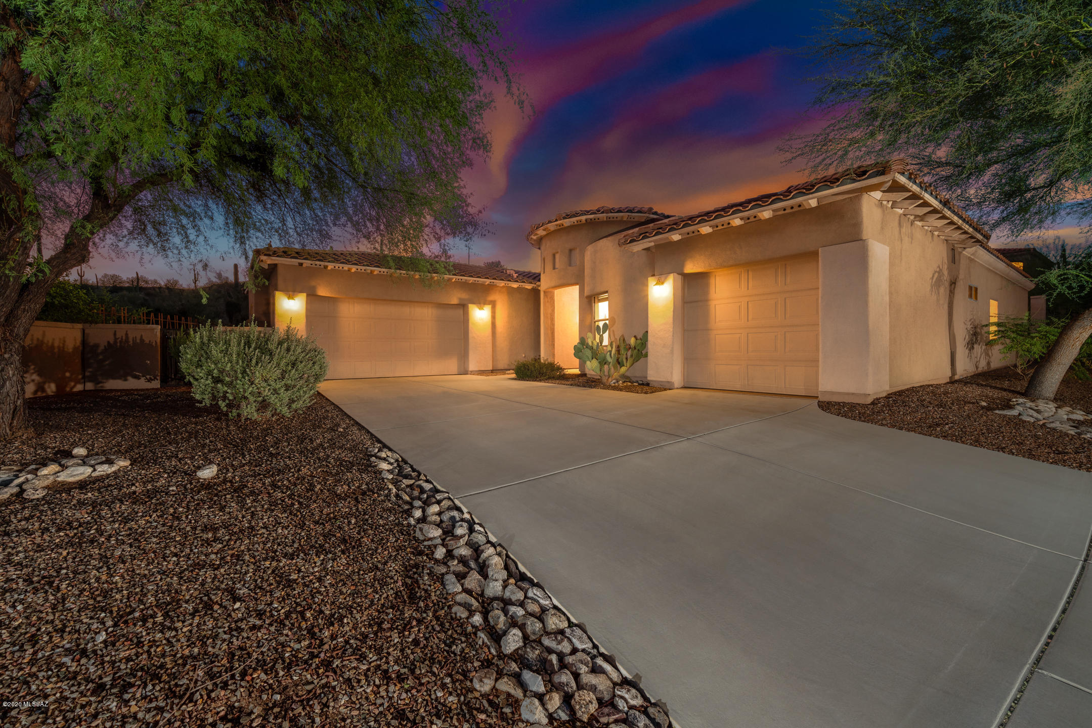 Gorgeous home in gated and guarded La Paloma with amazing convenience, views, and prestige. Step inside, enjoy the great room for virtually unlimited guest potential, and make sure to take notice of the fireplace for those cool winter nights. Embrace this kitchen - you'll notice beautiful high-end cabinetry, bullnose granite countertops, gas stove - plus, additional induction wall appliances in the kitchen - builder upgrades, nonetheless. Seating areas encompass a nook and dining area with a view of the Catalinas after a day of golf at La Palomas Signature 36 holes (consider the very inexpensive memberships). The split bedroom plan is the perfect feature for this home that gives the primary bedroom an oversized feel and access to the covered patio. Inside the primary bathroom, you'll find a separate shower, garden tub, and walk-in closet. From top to bottom, this home is perfectly maintained and impressively well thought out. Don't limit yourself from the ideal vacation home, winter escape, or build your own Air BNB for a "we won't ever sell" house in our gorgeous city. Landscape architect plans with two different options available, just ask - your next chapter starts here!