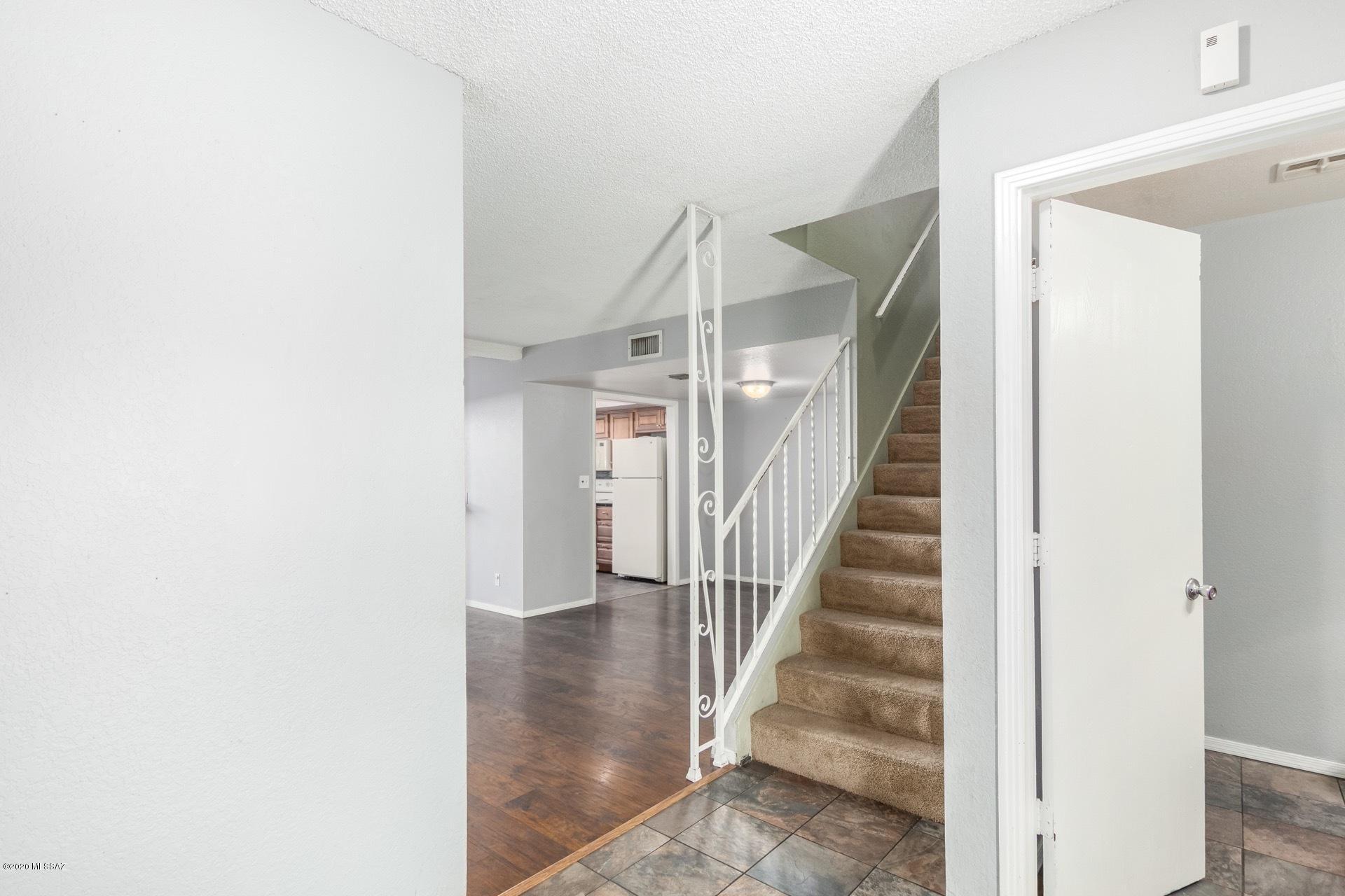You will love this townhome located in Central Tucson in Valle Cereza with only 59 units! This home is 1425 square feet with 3 bedrooms, 2-1/2 baths, black granite tile counters, no carpet on the main floor, ceiling fans in bedrooms, new water heater, patio area and two covered parking spots. HOA includes large community pool, play area and basketball court.