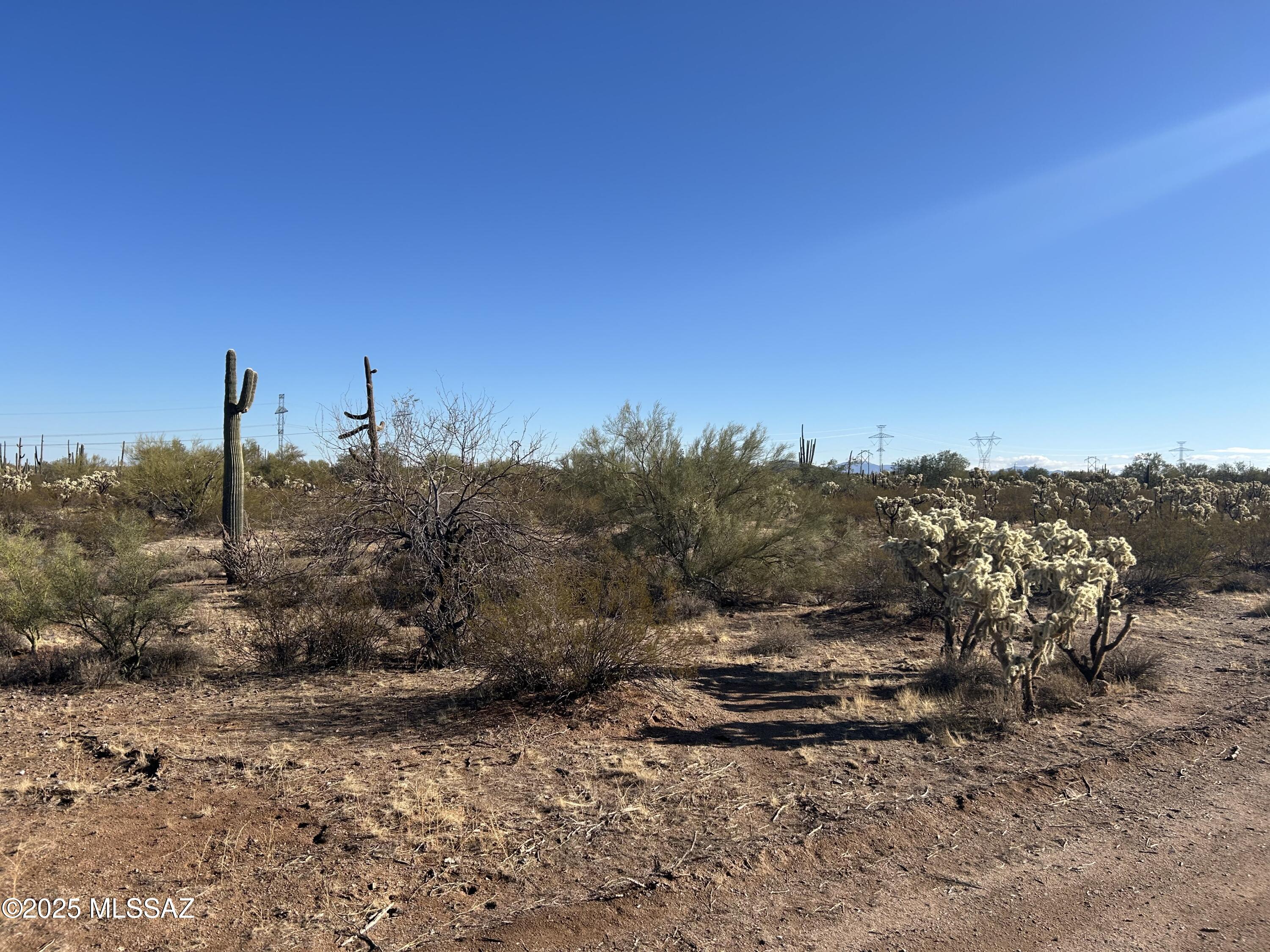 Amazing 20 acres for sale in Marana with room for all your dreams! This off-grid, no HOA, property offers mature trees and saguaros with 360 views from Mt Lemmon to Picacho Peak. The land is flat with plenty of space to make your dreams come to life. Backing up to BLM land, you have endless trails for hiking, driving, or riding. Come take a look and fall in love!