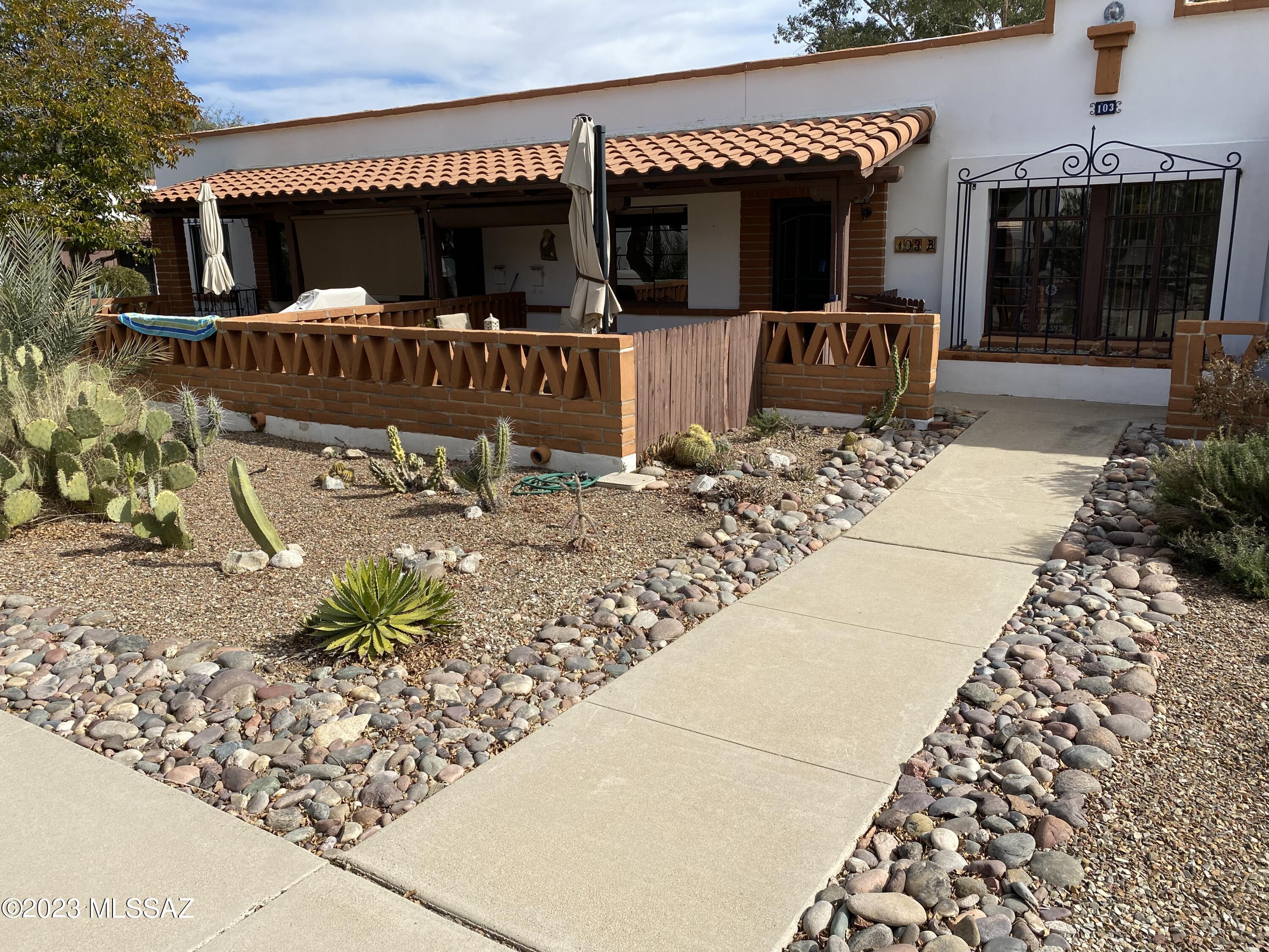 Ideal location in Villas West. Front patio opens to one of the many green spaces. Kitchen has been updated and includes all appliances. Bedroom has custom built-in desk and storage. Bath has updates and includes newly installed exhaust fan. Roof was replaced in 2022. All patio furniture, citrus tree and solar shade will convey. Finished laundry has full sized stack washer/dryer and storage. Steel security doors front and back. Villas West features four pools and sidewalks throughout. HOA fee includes water, landscaping, exterior painting, water heater, HVAC and trash pick-up. Buyer should check with management office for details. Unit has been professionally cleaned and is ready for move -in! Come enjoy the great lifestyle of Villas West!
