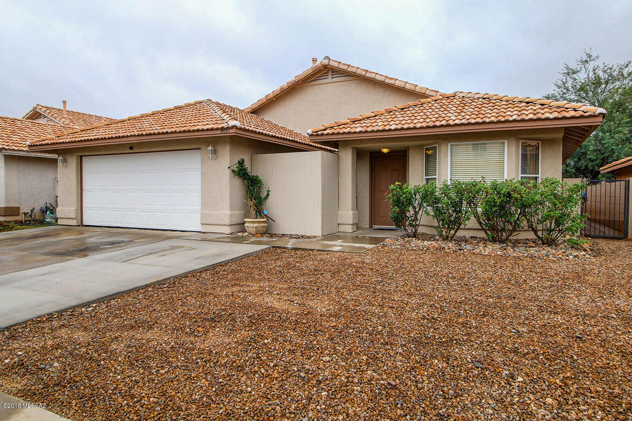 No HOA for this small 51 site Countryside Crossings subdivision. Super convenient to I-10 and shopping areas. This 3/2 has a den in addition to the living room/dining room & huge great room. There is a built-in dining set in the updated country kitchen. The distressed kitchen cabinets have matching window shutters & a farmhouse style island with breakfast bar. The framed recessed TV mount above the stacked stone fireplace in the homey great room provides a sleek TV viewing area . Sliding glass doors lead to a covered patio with additional uncovered patio slab within a block walled yard shaded by a large mesquite tree. Both full baths have dual sink vanities & the Master Bath has an updated, elegant master shower with 2 rain shower heads. Two car garage + extra parking slab